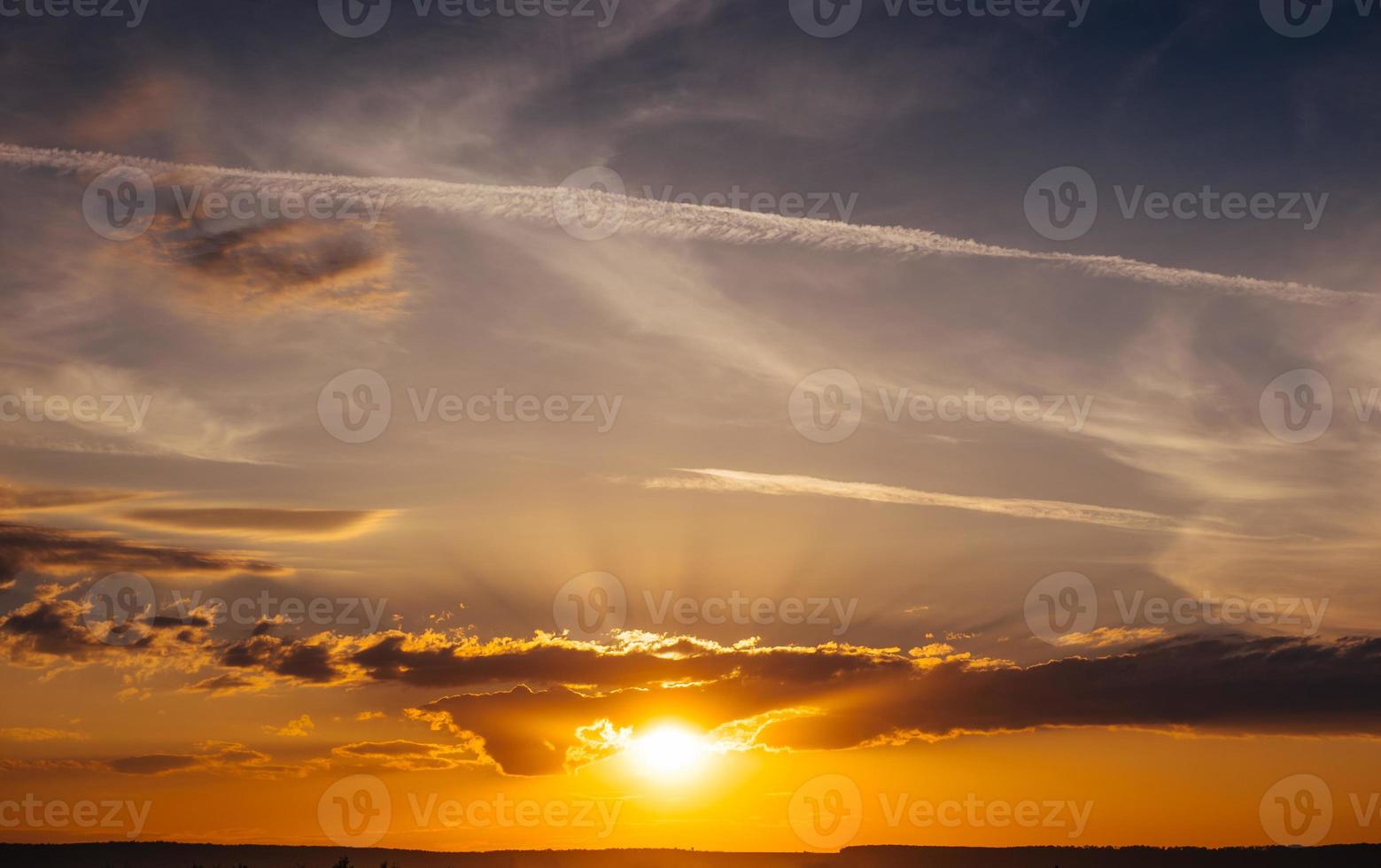Sunset sunrise with clouds, light rays and other atmospheric e photo