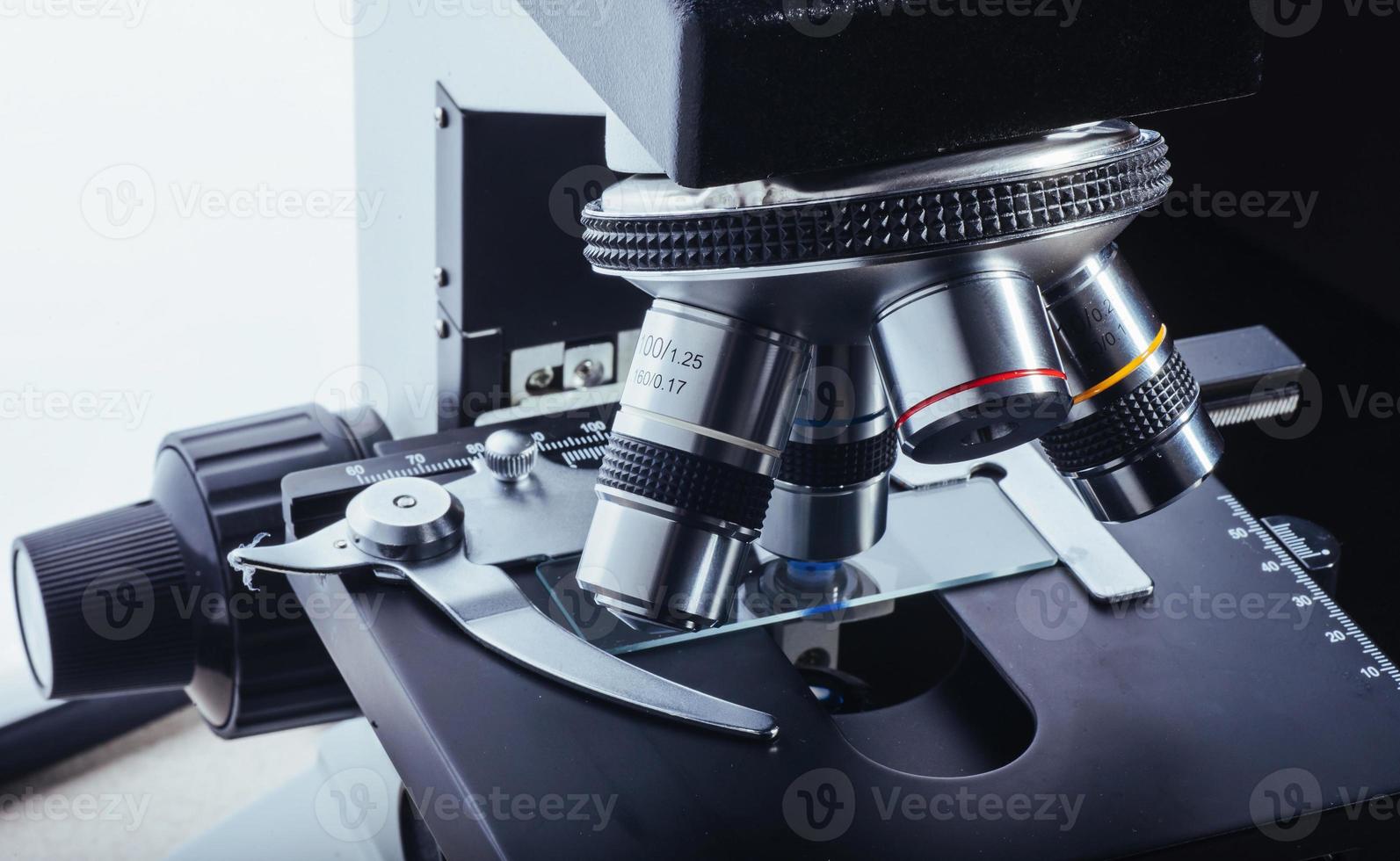 Close up of microscope at the laboratory. photo