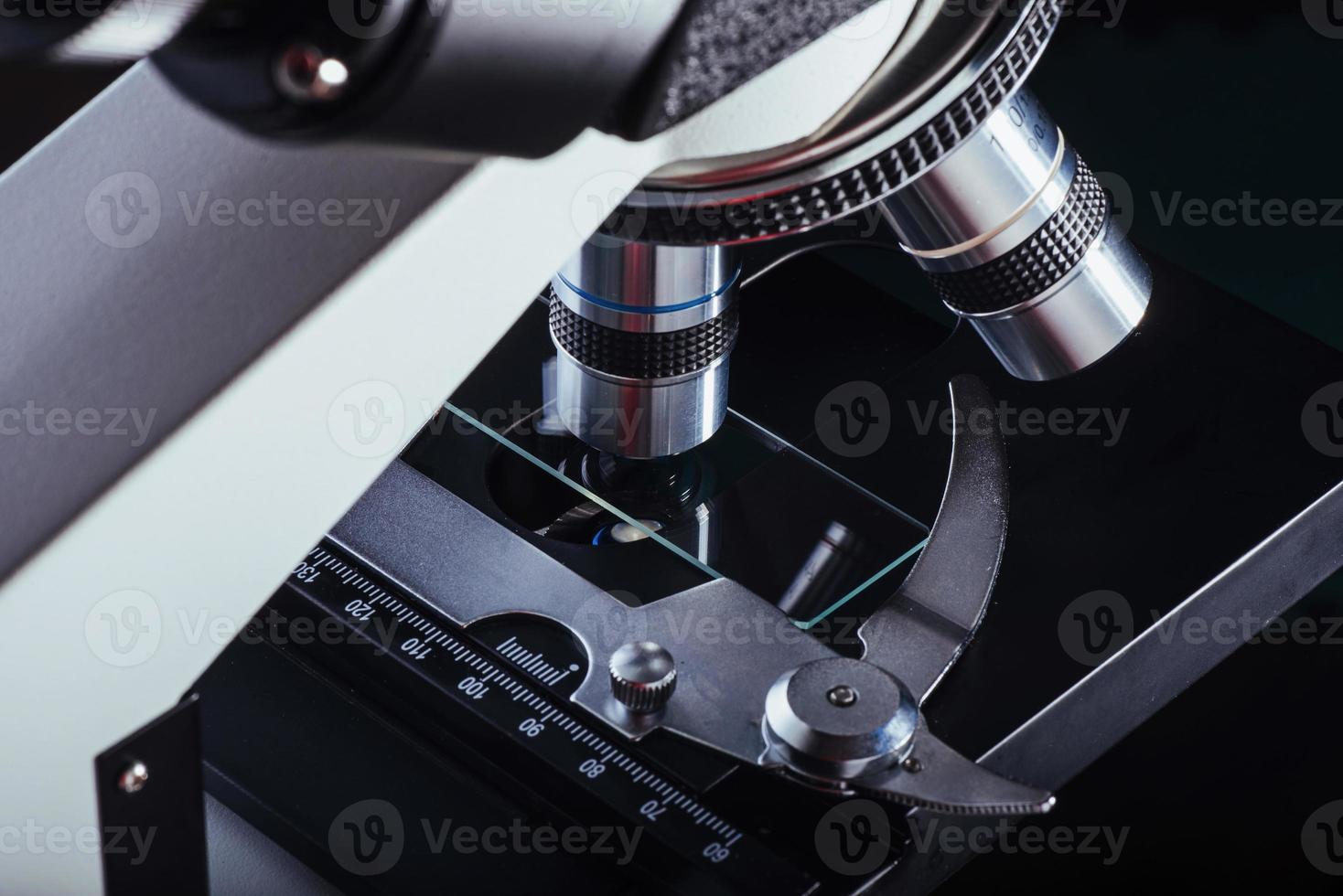 Close up of microscope at the laboratory. photo