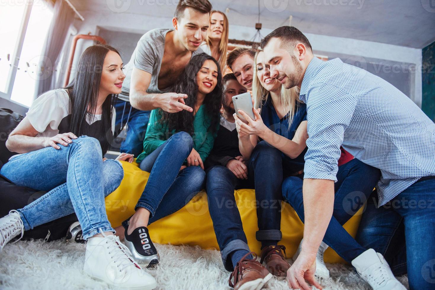 Group portrait of Cheerful old friends communicate with each other, friend posing on cafe, Urban style people having fun, Concepts about youth togetherness lifestyle. Wifi connected photo