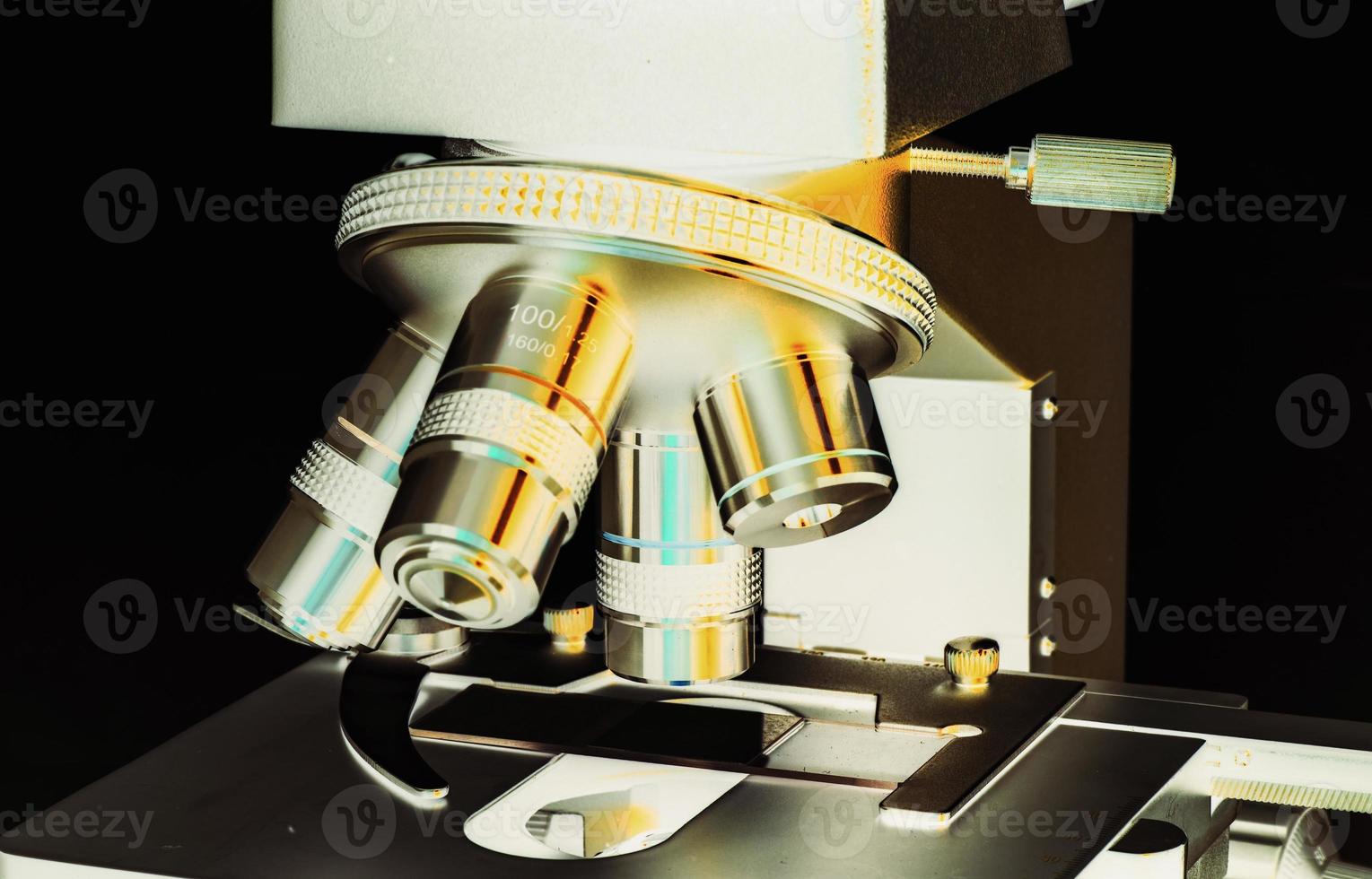 Close up of microscope at the laboratory. photo