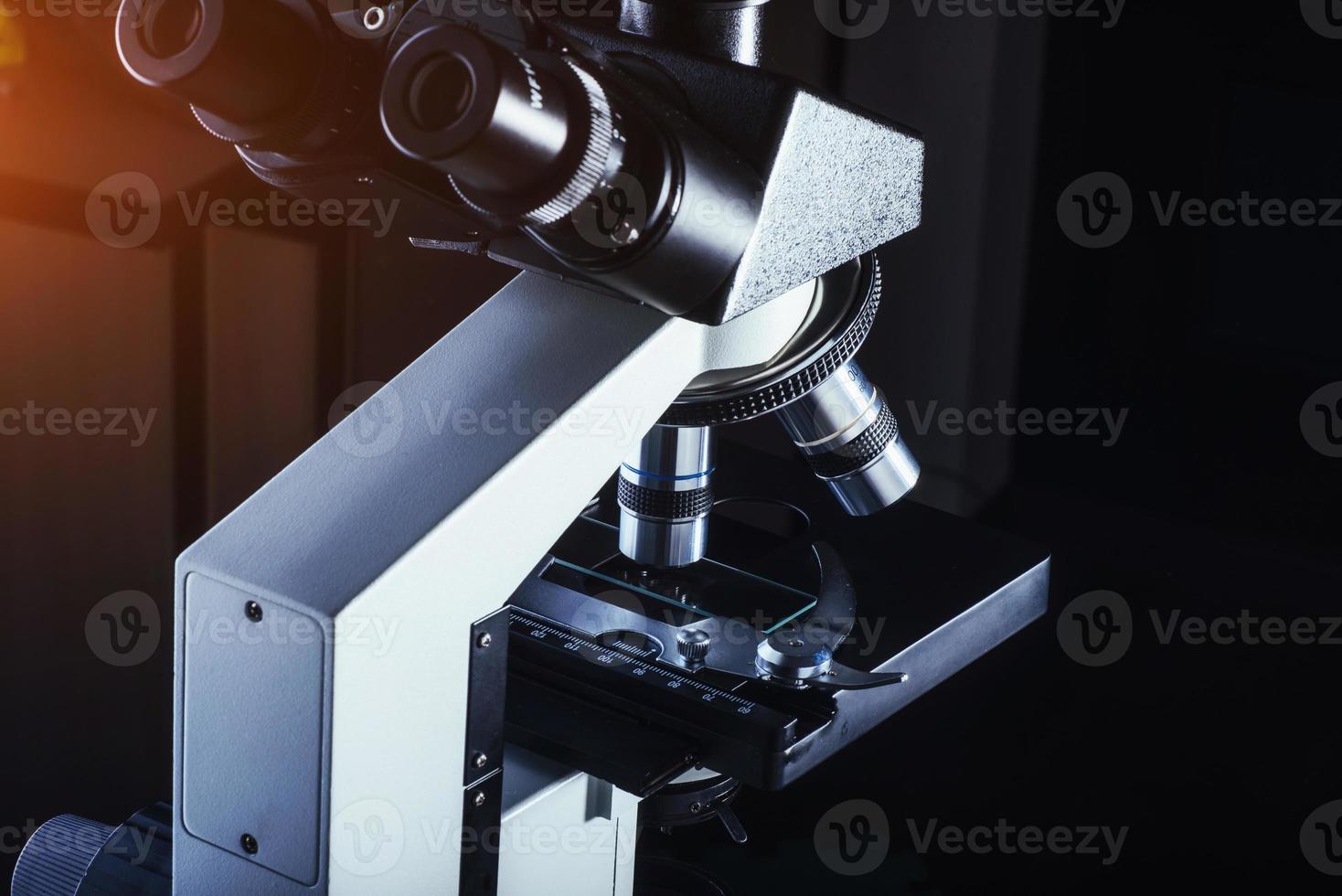 Close up of microscope at the laboratory. photo