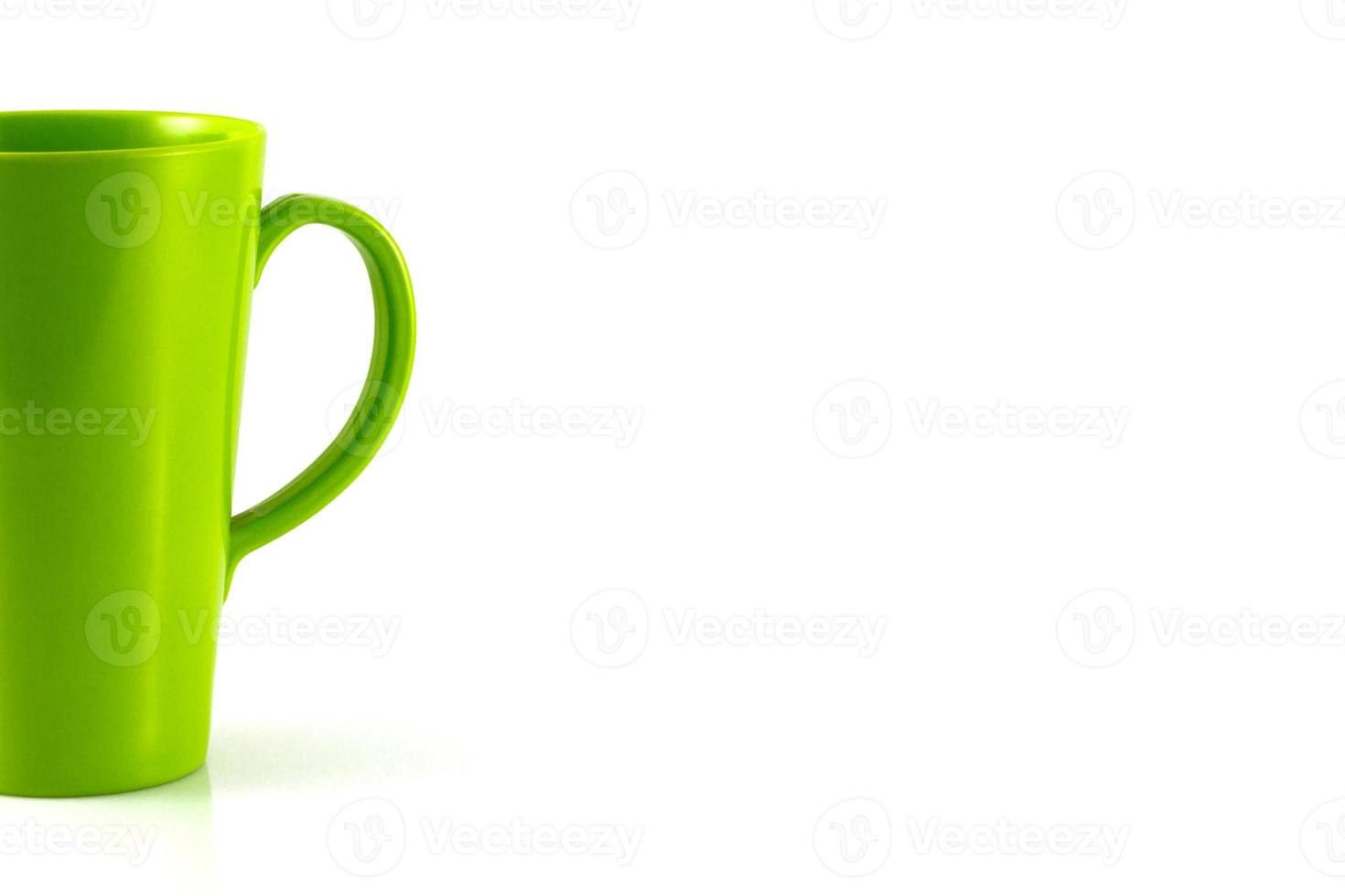 Green plastic cup isolate on white background photo