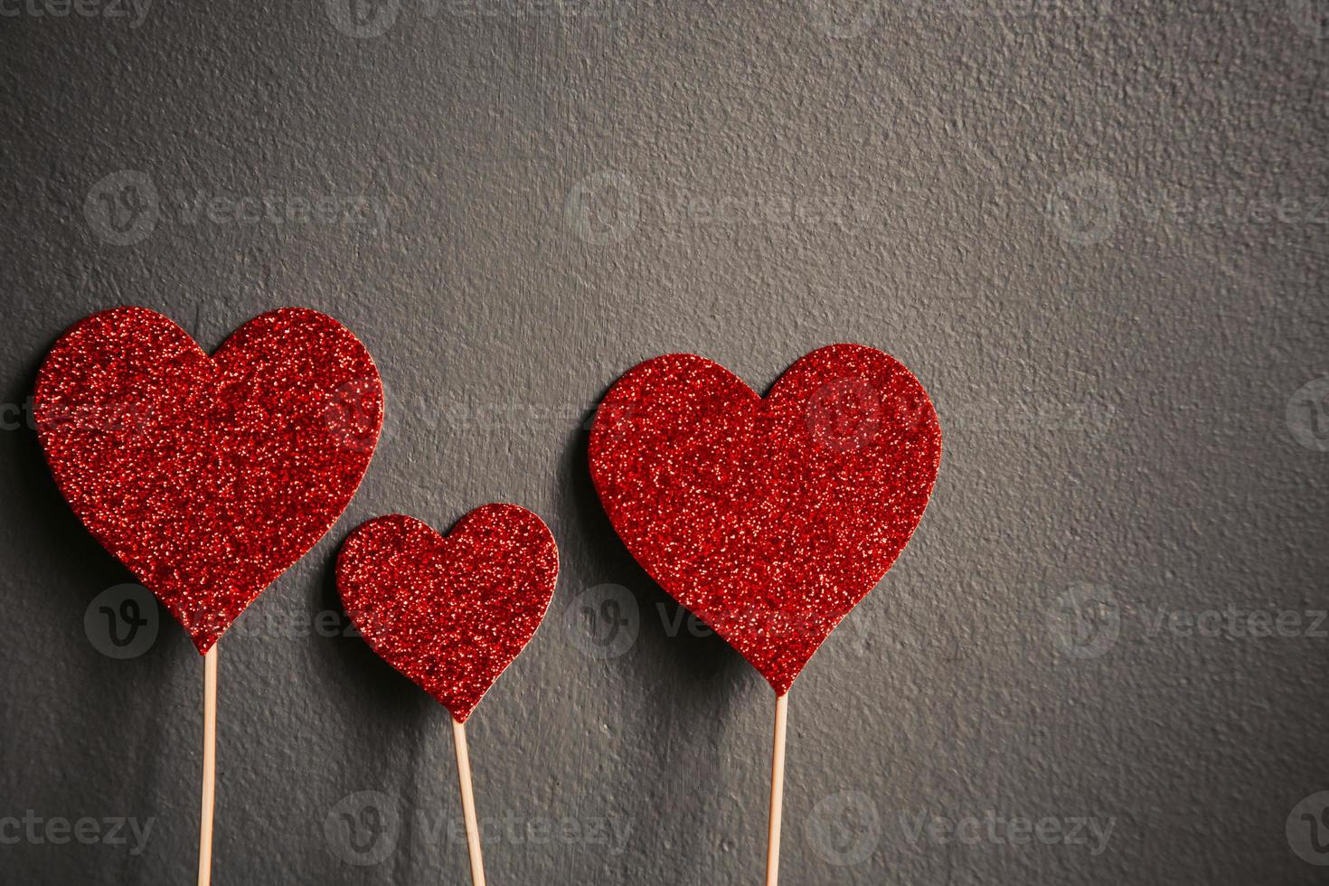 Red hearts shape isolated on grey background with copy space photo