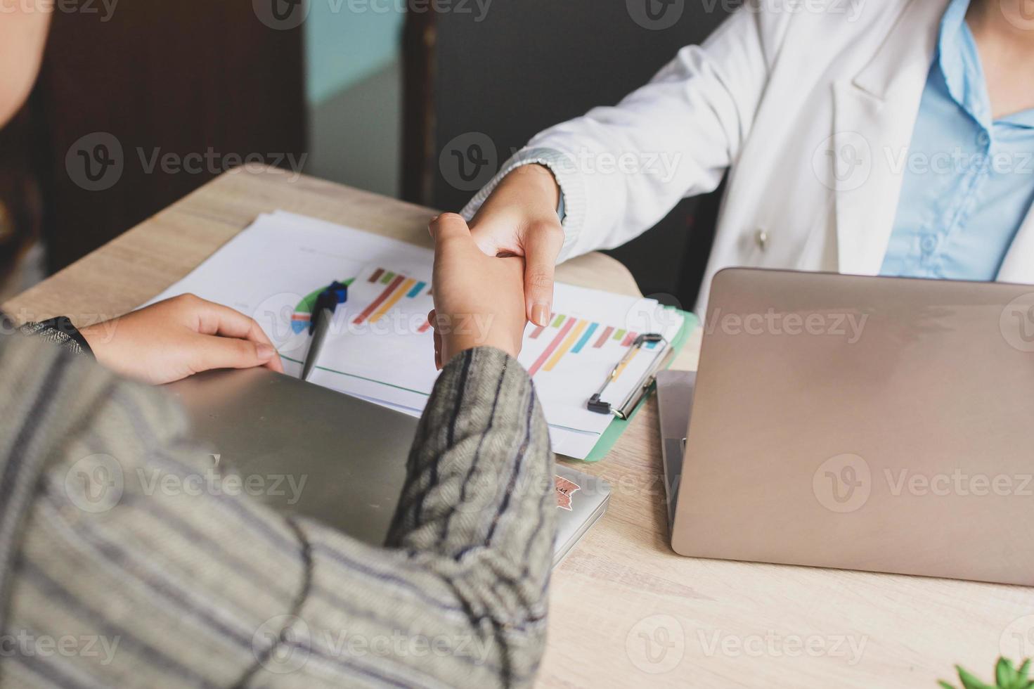 Cropped shot of business woman handshake for teamwork of business merger and acquisition, successful negotiate, hand shake, shake hand with partner to celebration partnership and business deal concept photo