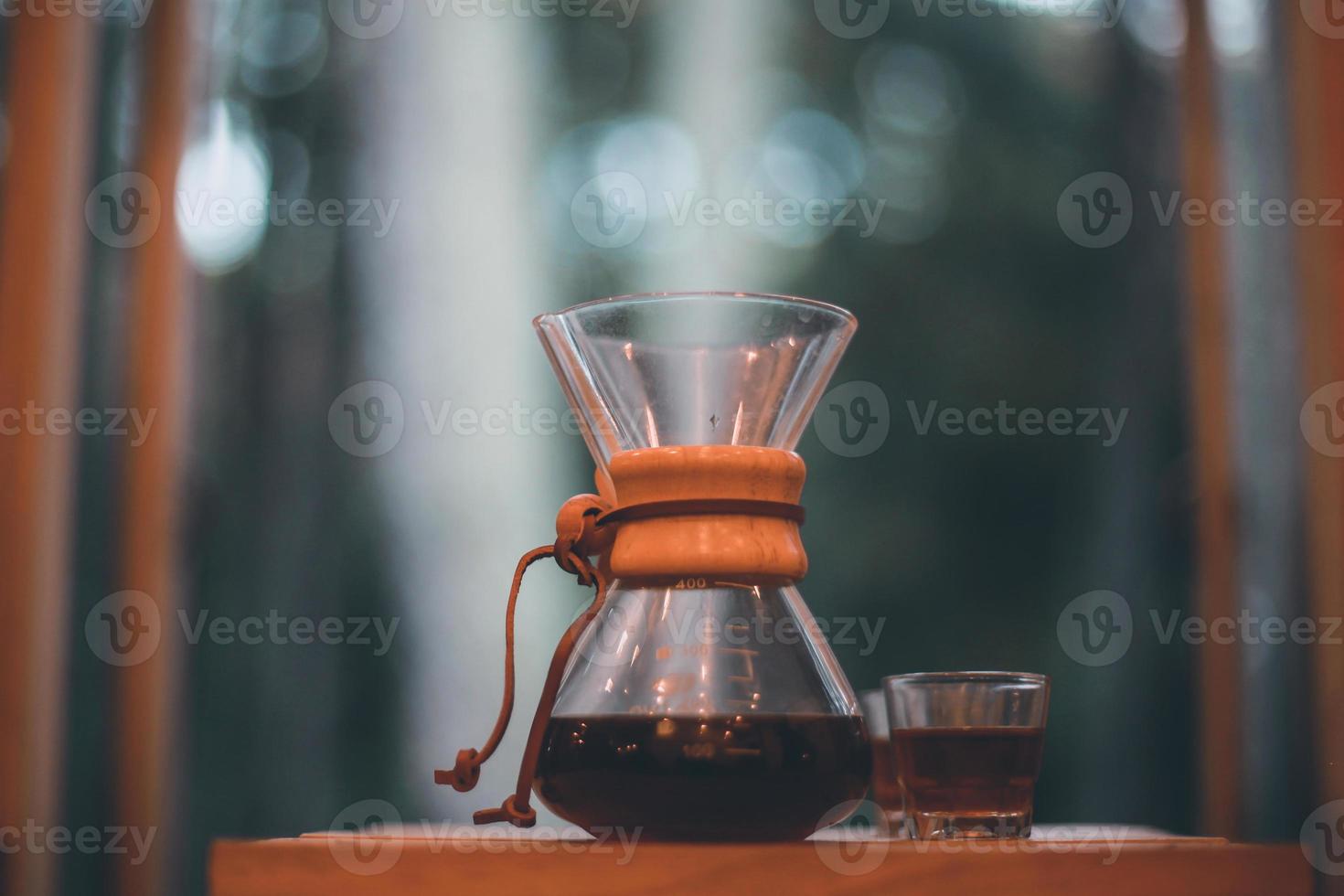 V60 Coffee on the wooden table with blurry background photo