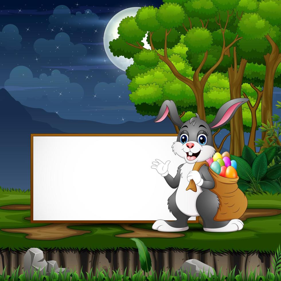 Easter bunny carrying a sack of easter eggs in front the blank sign vector