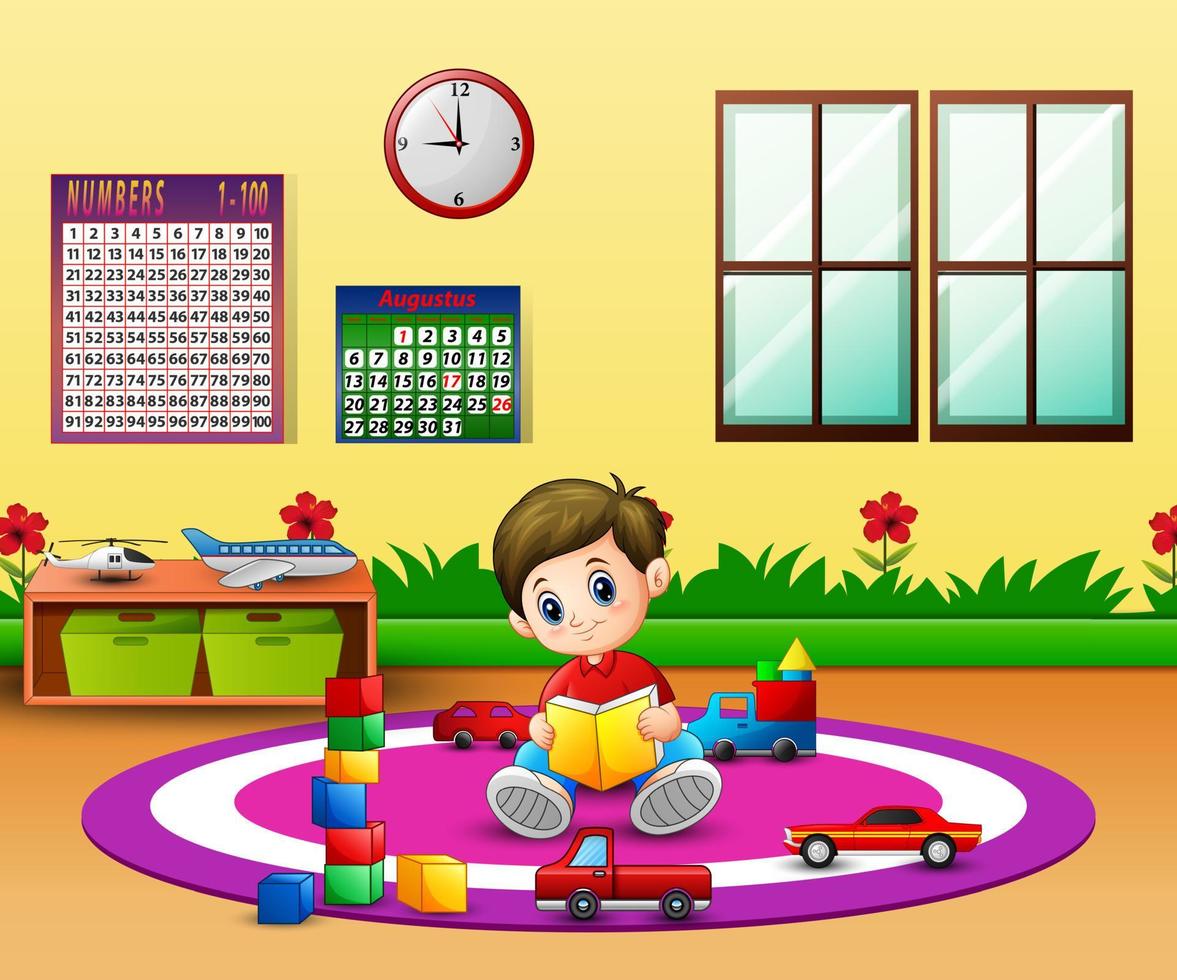 A boy reading a book on round carpet in kindergarten classroom vector