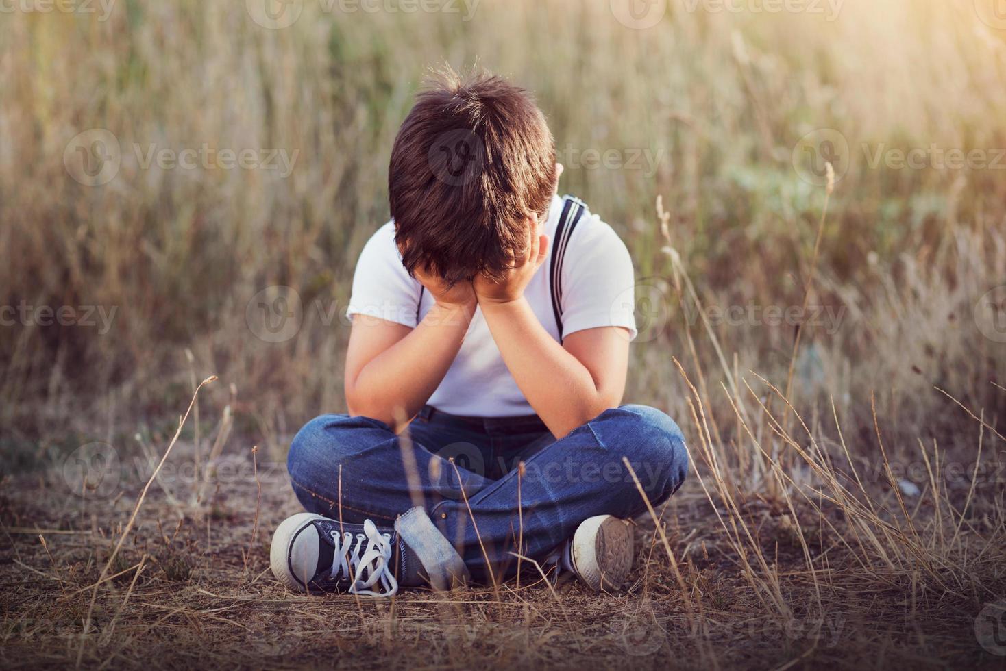 crying boy outdoor photo