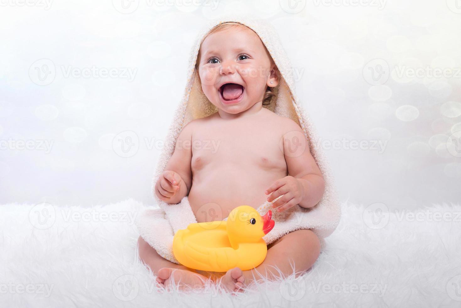 Happy baby in a towel photo