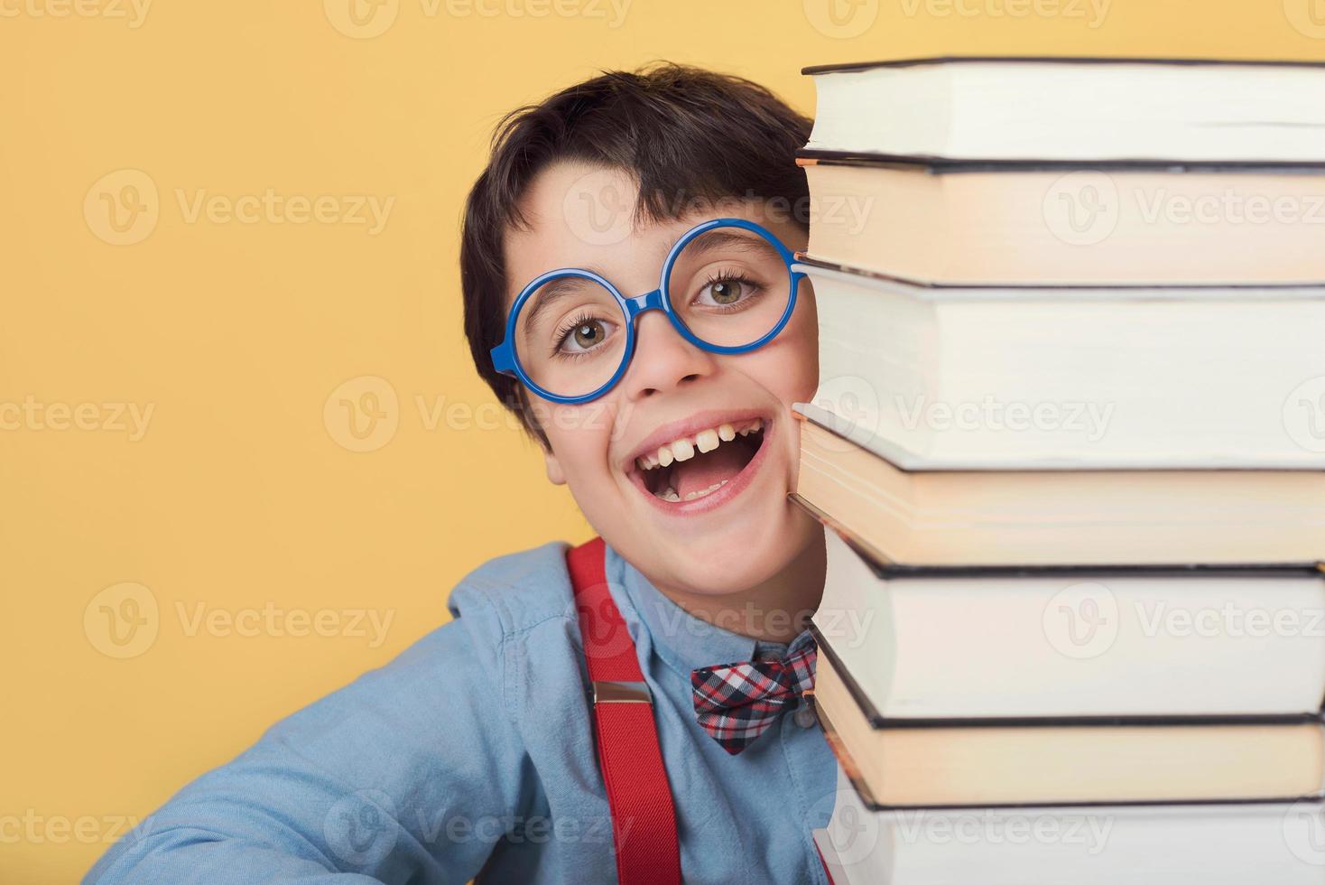 happy and smiling child with books photo