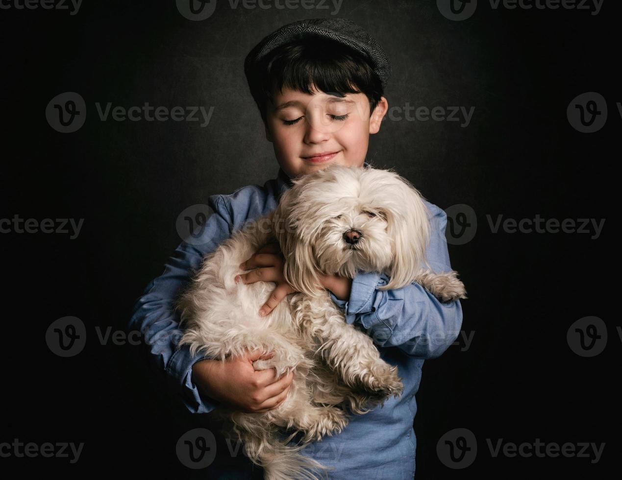 boy hugging his dog photo