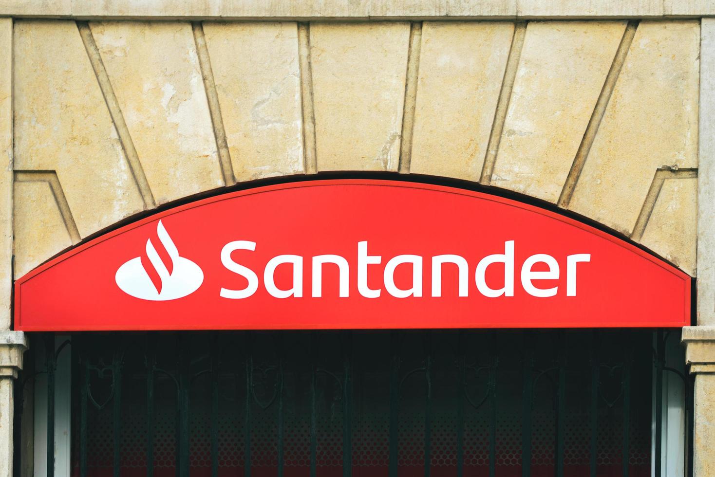 Santander Bank sign logo of branch office in the city photo