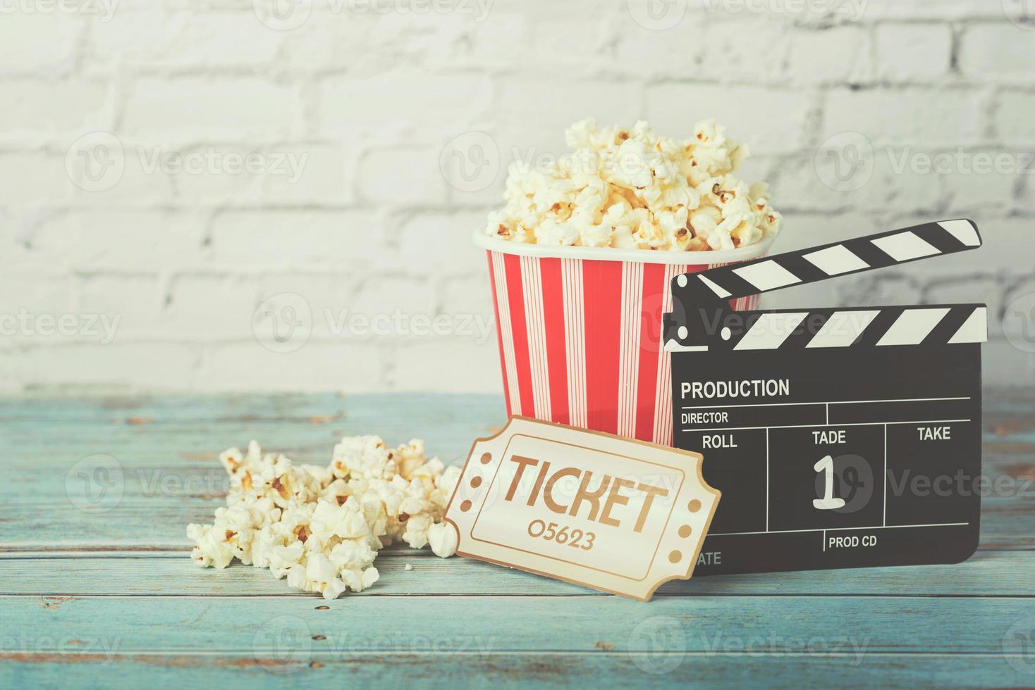 Cinema movie concept, popcorn and clapperboard photo