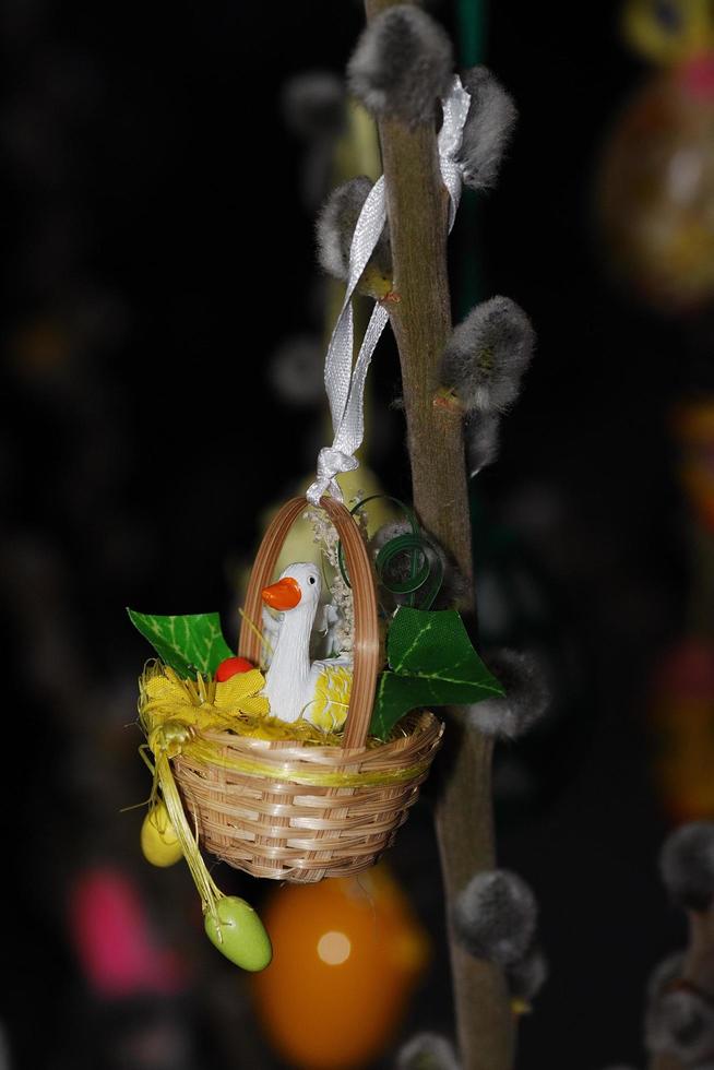 closeup of a duck in a basket on the easter tree photo
