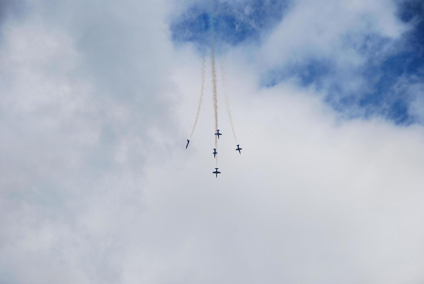 five planes fly down from the blue sky fast photo