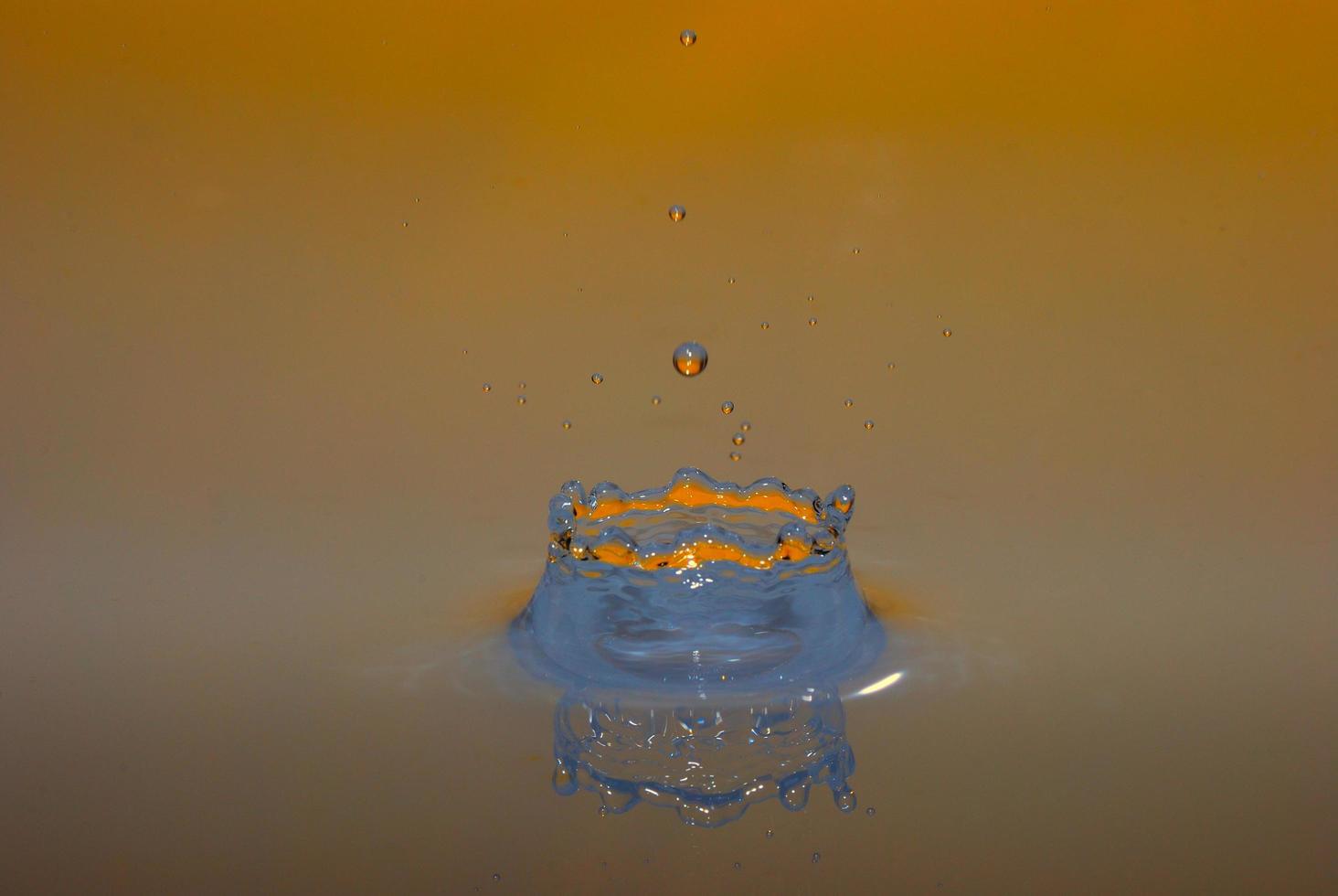 drops impacting orange photo