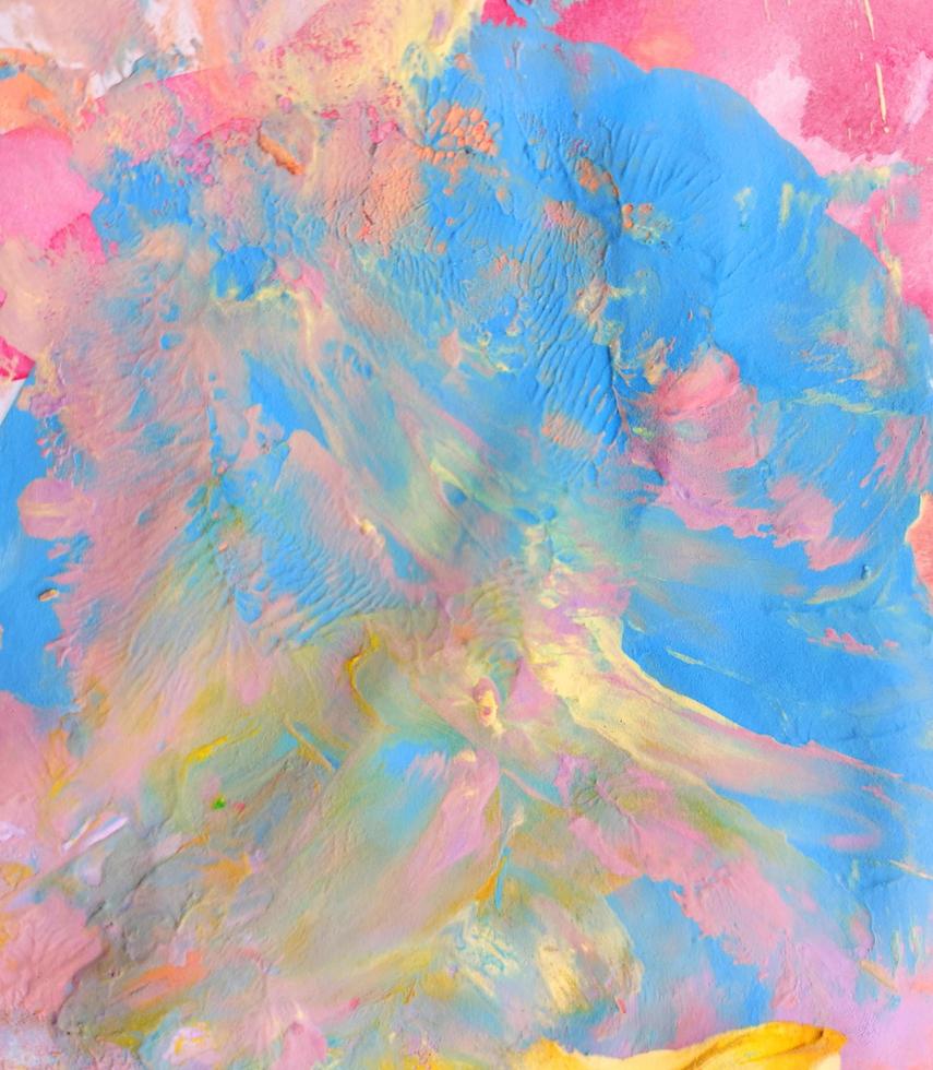 blue, pink and yellow colors paint texture on paper background. wallpaper. photo