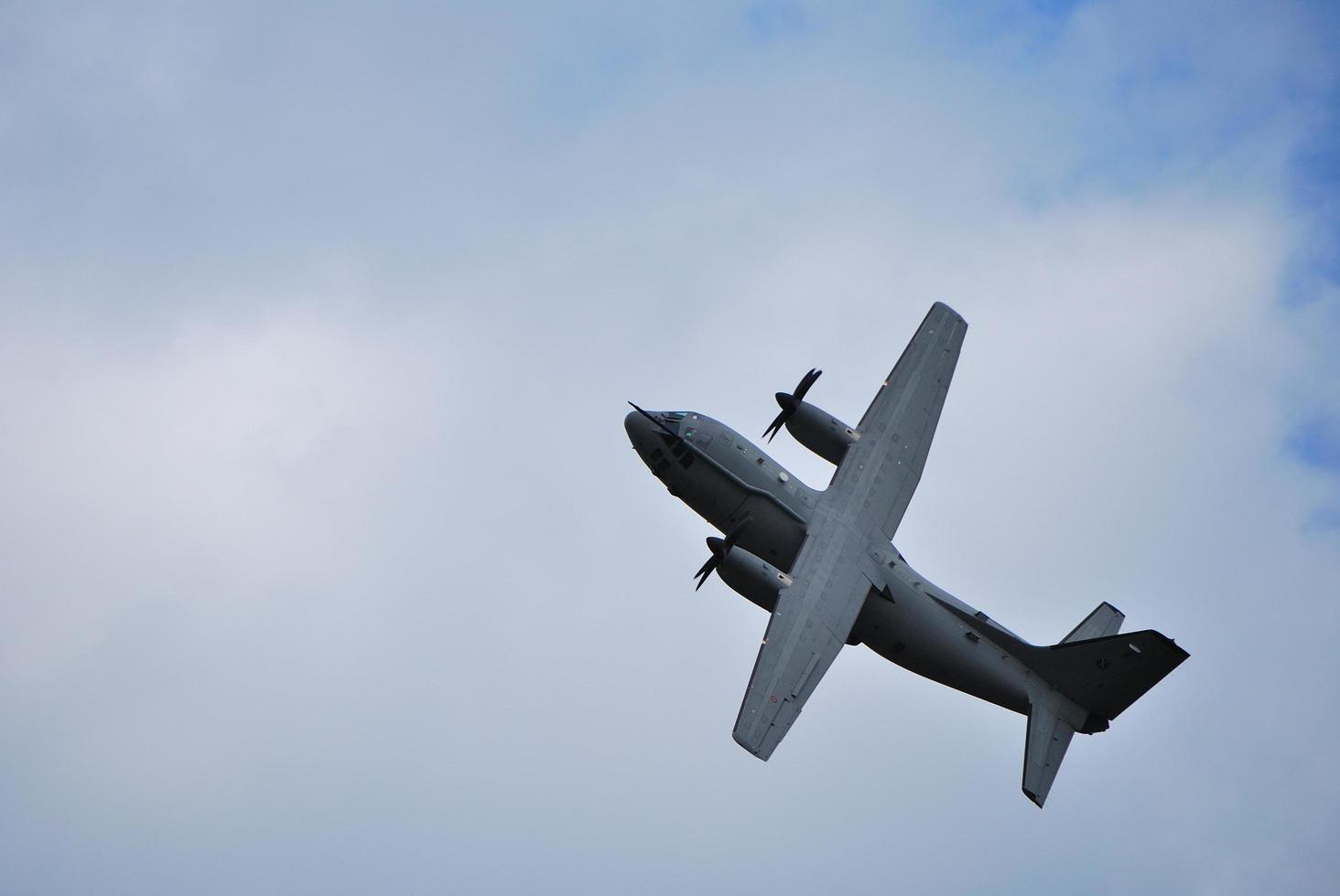 giant big plane flies looping at an air show photo