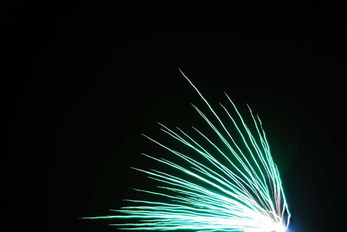near green explosion at a fireworks in the night of new year photo