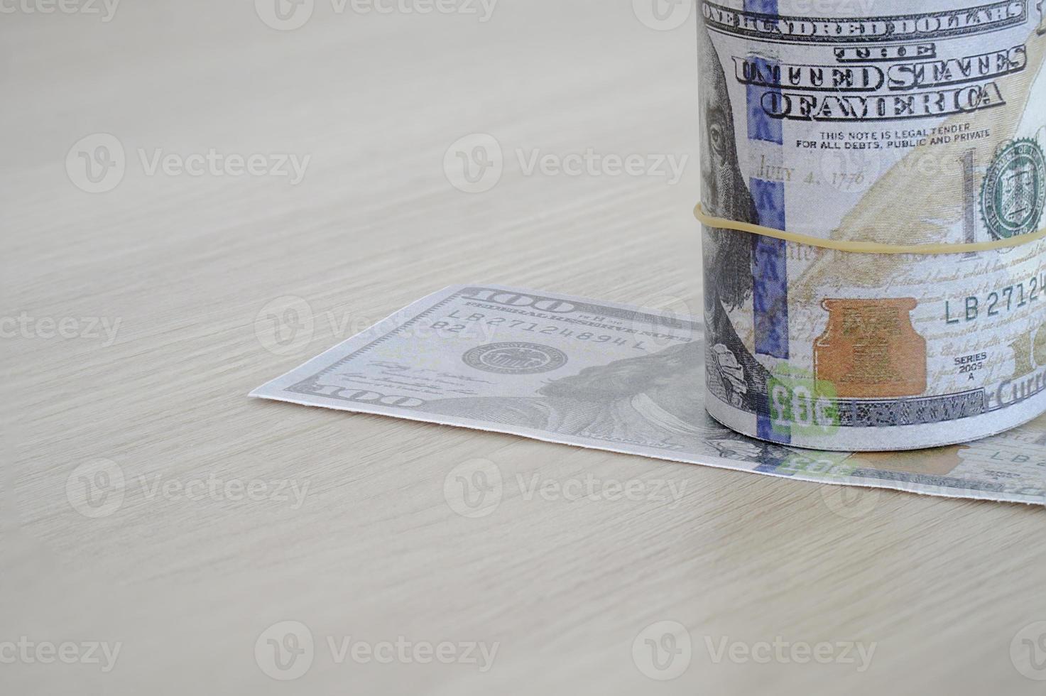 roll of hundred dollar bills photo