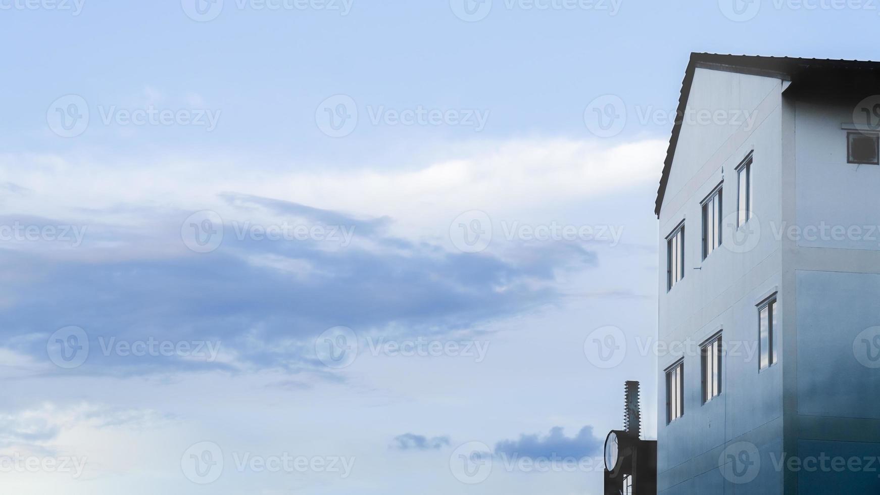 Window and Roof with Clouds in the Sky photo