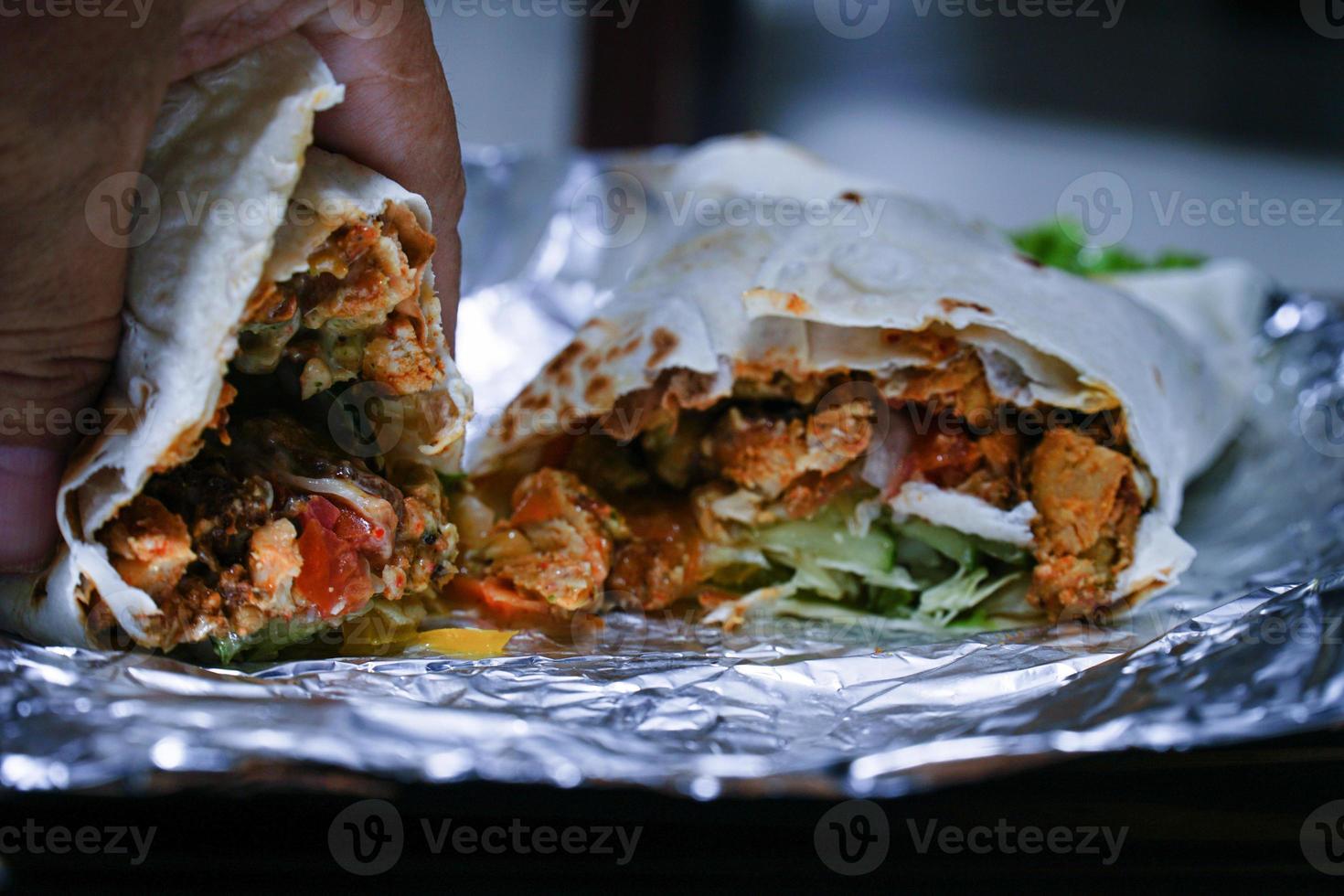 Fresh Turkish doner kebab in a tortilla toast. photo