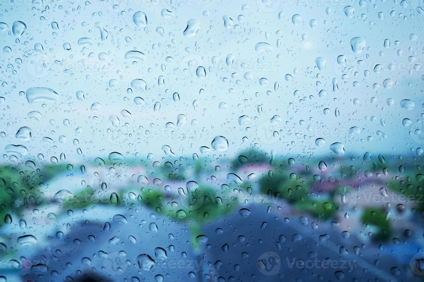 Rain drops on the glass surface. photo