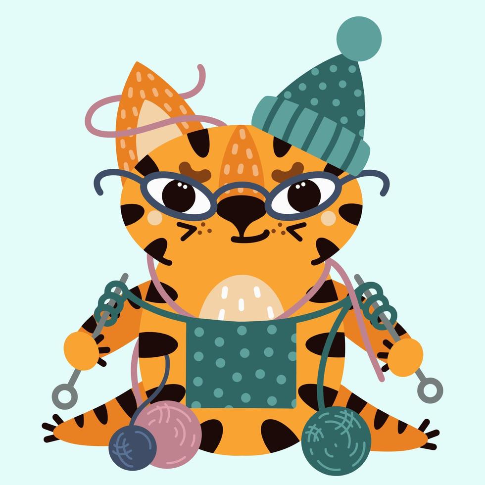 Cute cartoon striped tiger. Vector illustration isolated on white background. The cat with glasses knits. A kind kitten in a hat with woolen balls. Flat style, childish print.