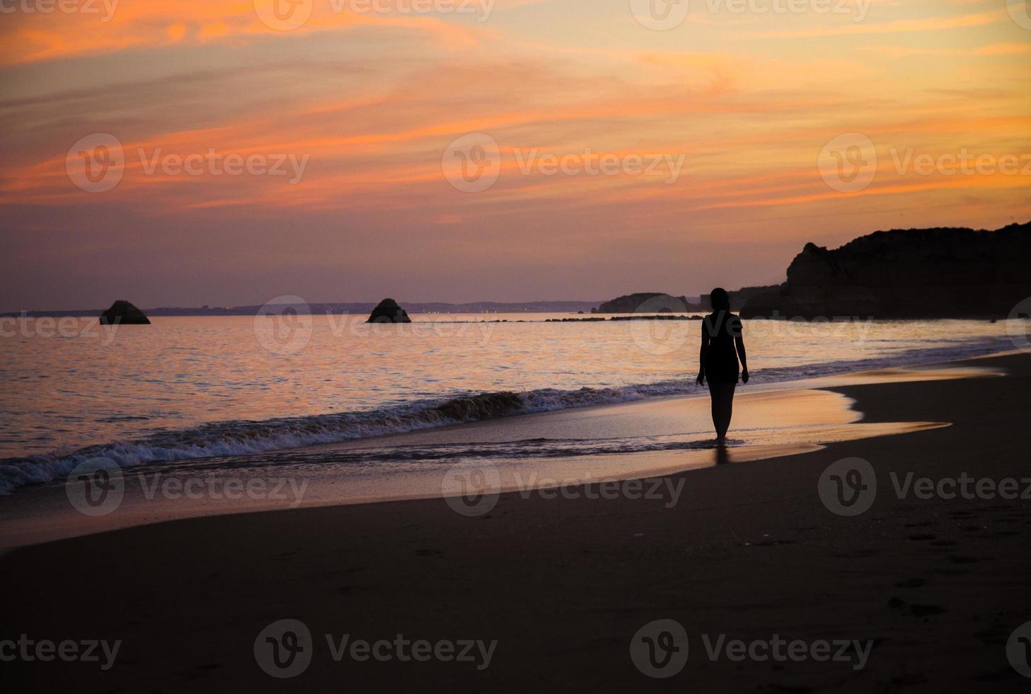 Portugal, Algarve, The best beaches of Portimao, Praia da Rocha, sunset over The Atlantic Ocean photo