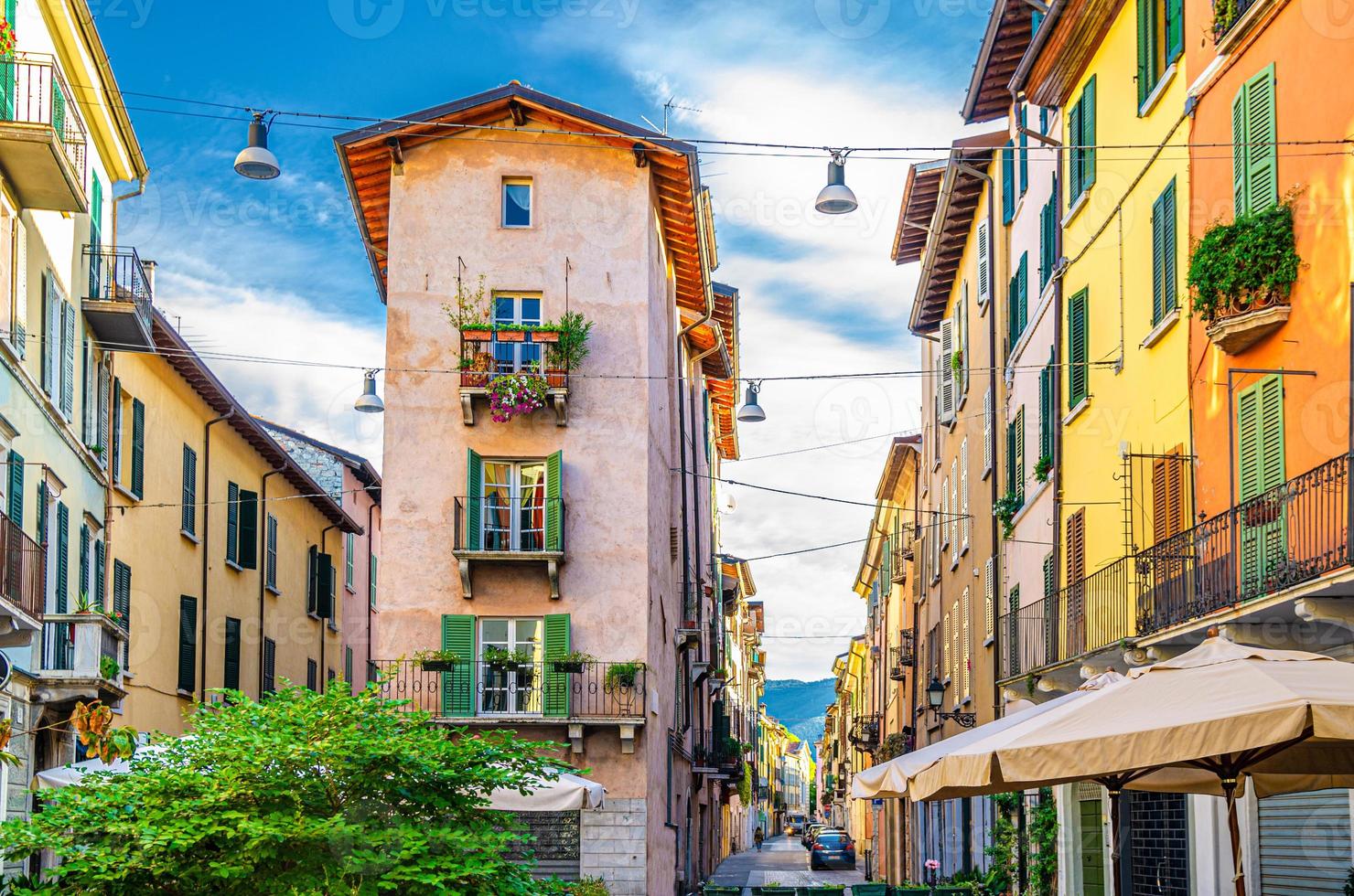 Traditional colorful building with balconies, shutter windows and multicolored walls photo