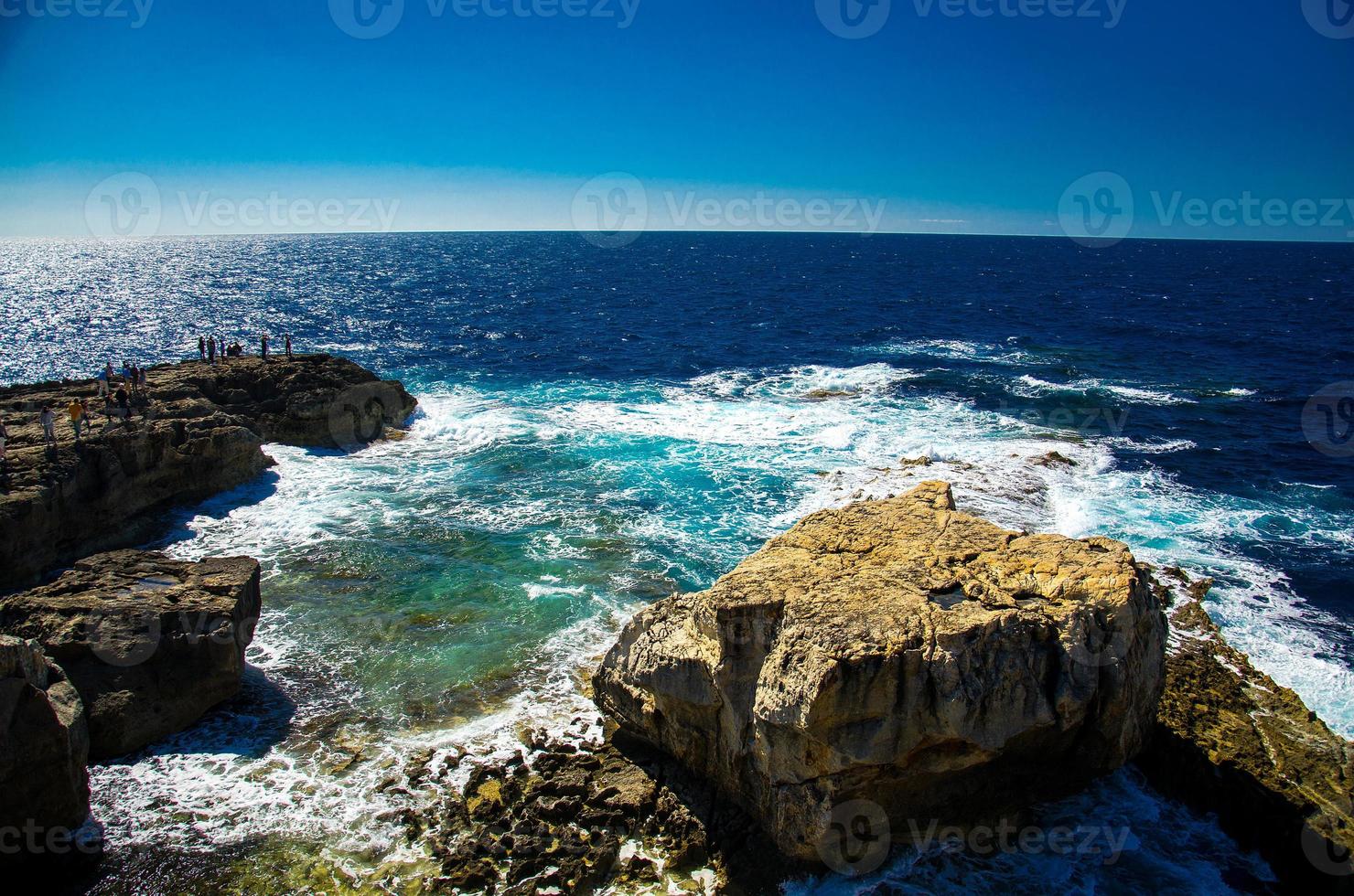 Rocky coastline cliffs near collapsed Azure window, Gozo island, Malta photo