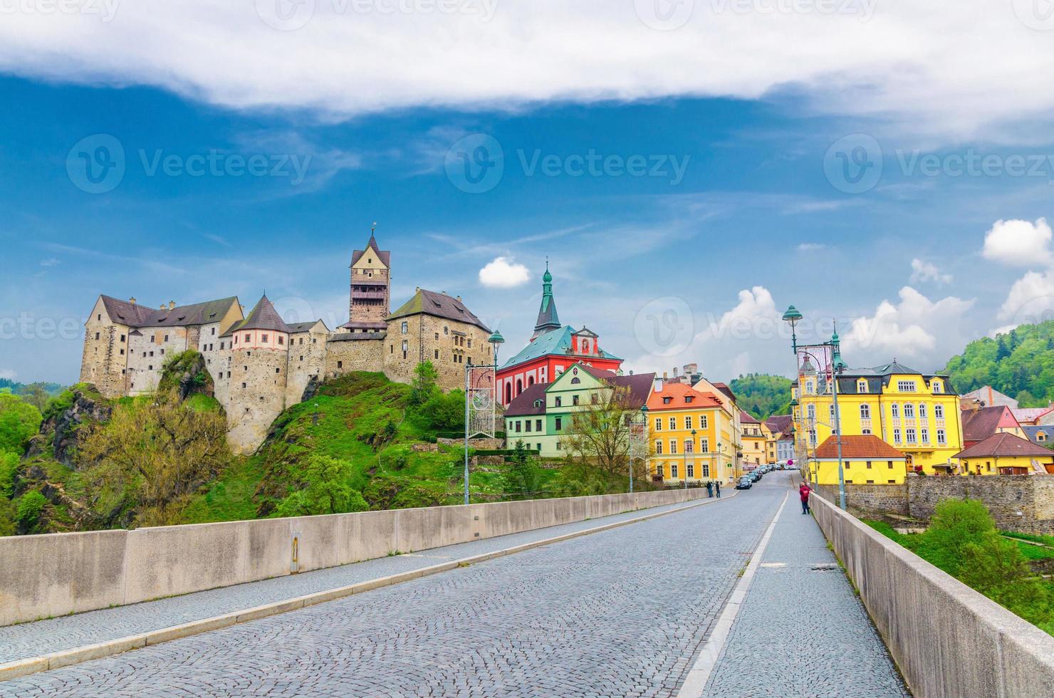 Loket Castle Hrad Loket gothic style building on massive rock, colorful buildings in town photo