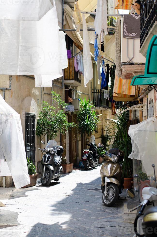 Old narrow streets of Bari city, Puglia, Southern Italy photo