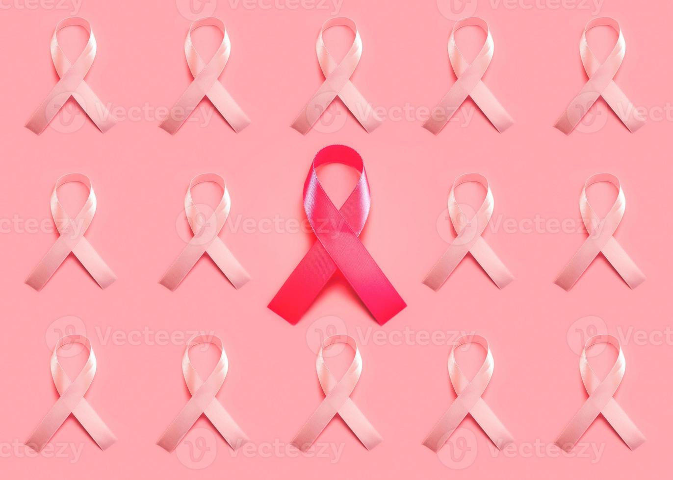 Breast cancer concept.Geometric pattern made with pink Ribbons photo