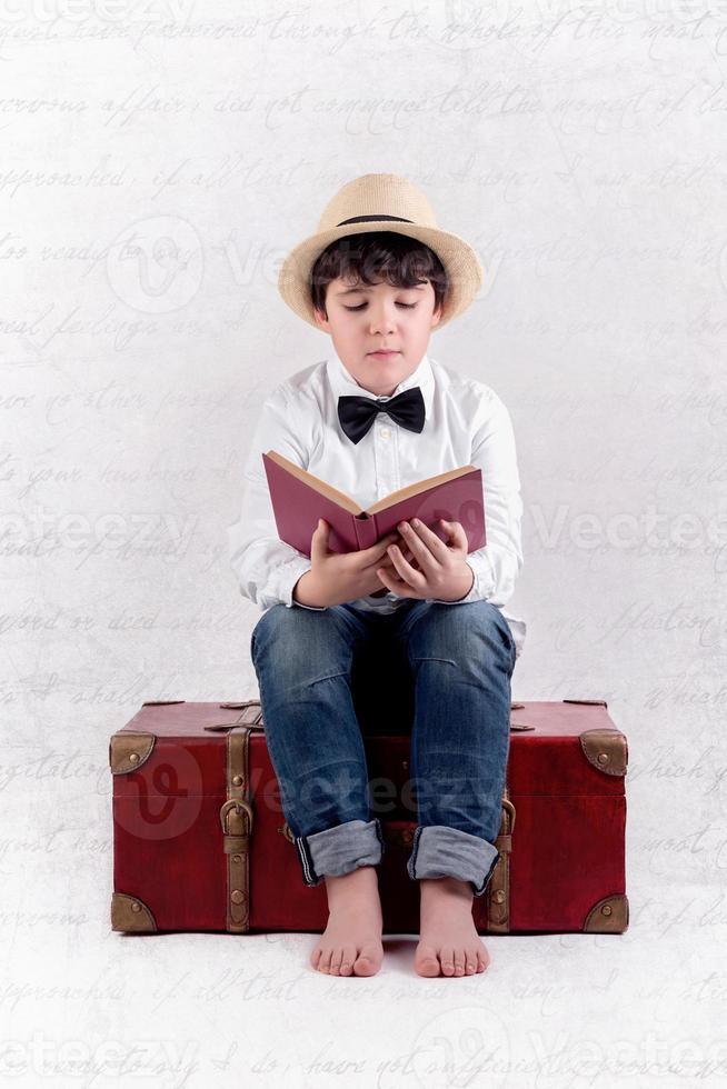 boy reading a book photo