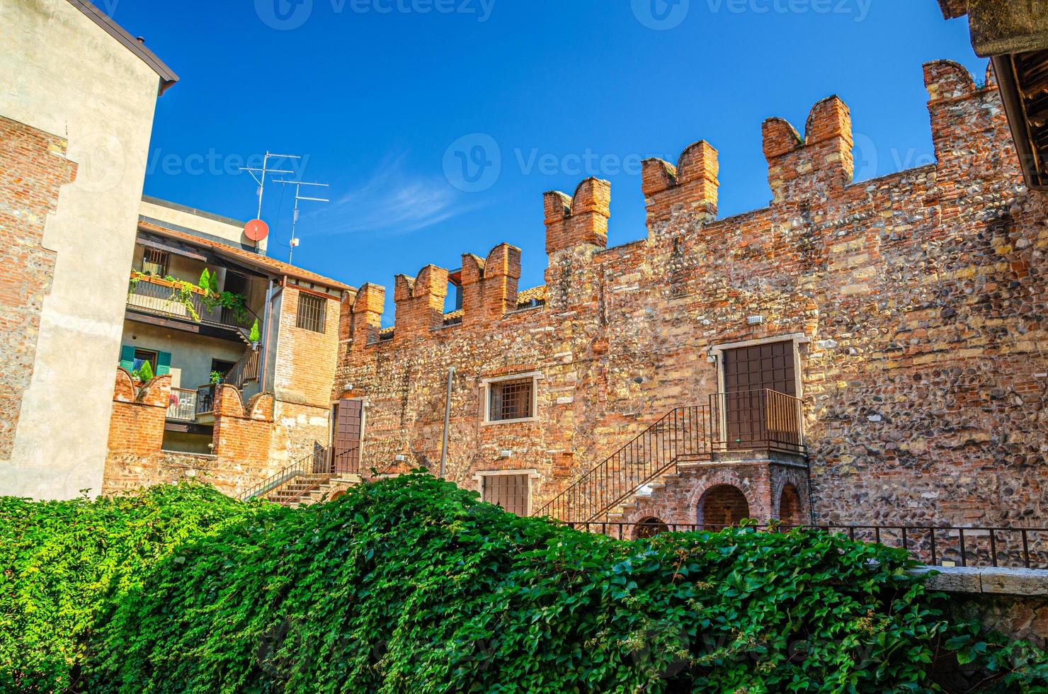 Teatro Nuovo theatre brick wall with merlons from Juliet balcony of Casa di Giulietta photo