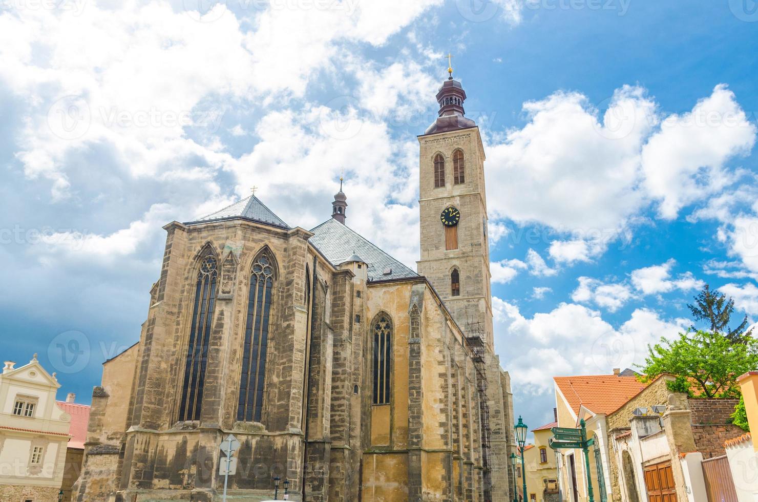 The Church of St James catholic church building with clock tower in Kutna Hora photo