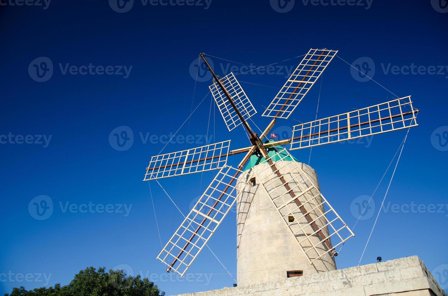 Windmill on a blue sky background on Gozo Island, Malta photo