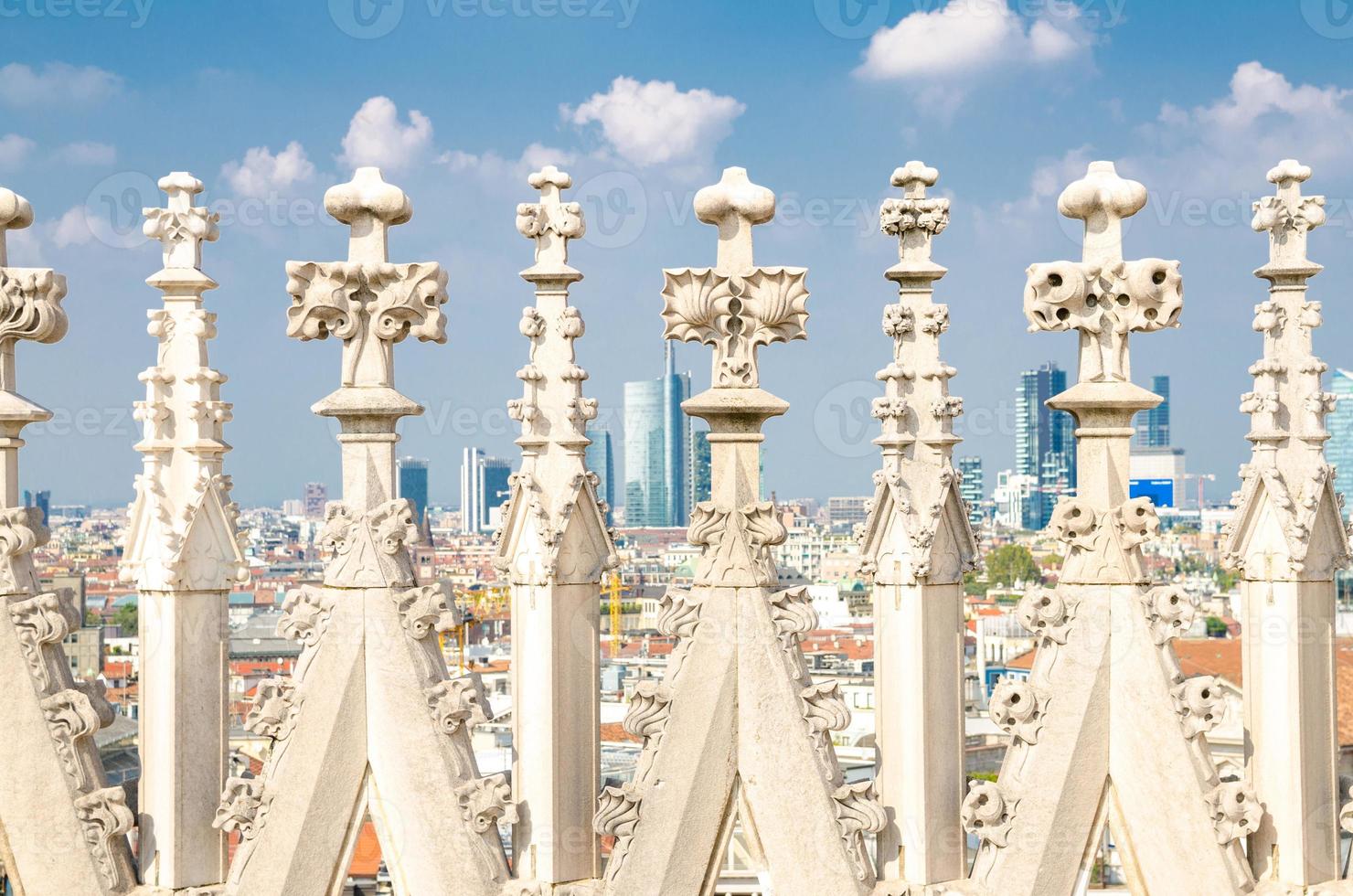White marble statues on roof of Duomo di Milano Cathedral, Italy photo