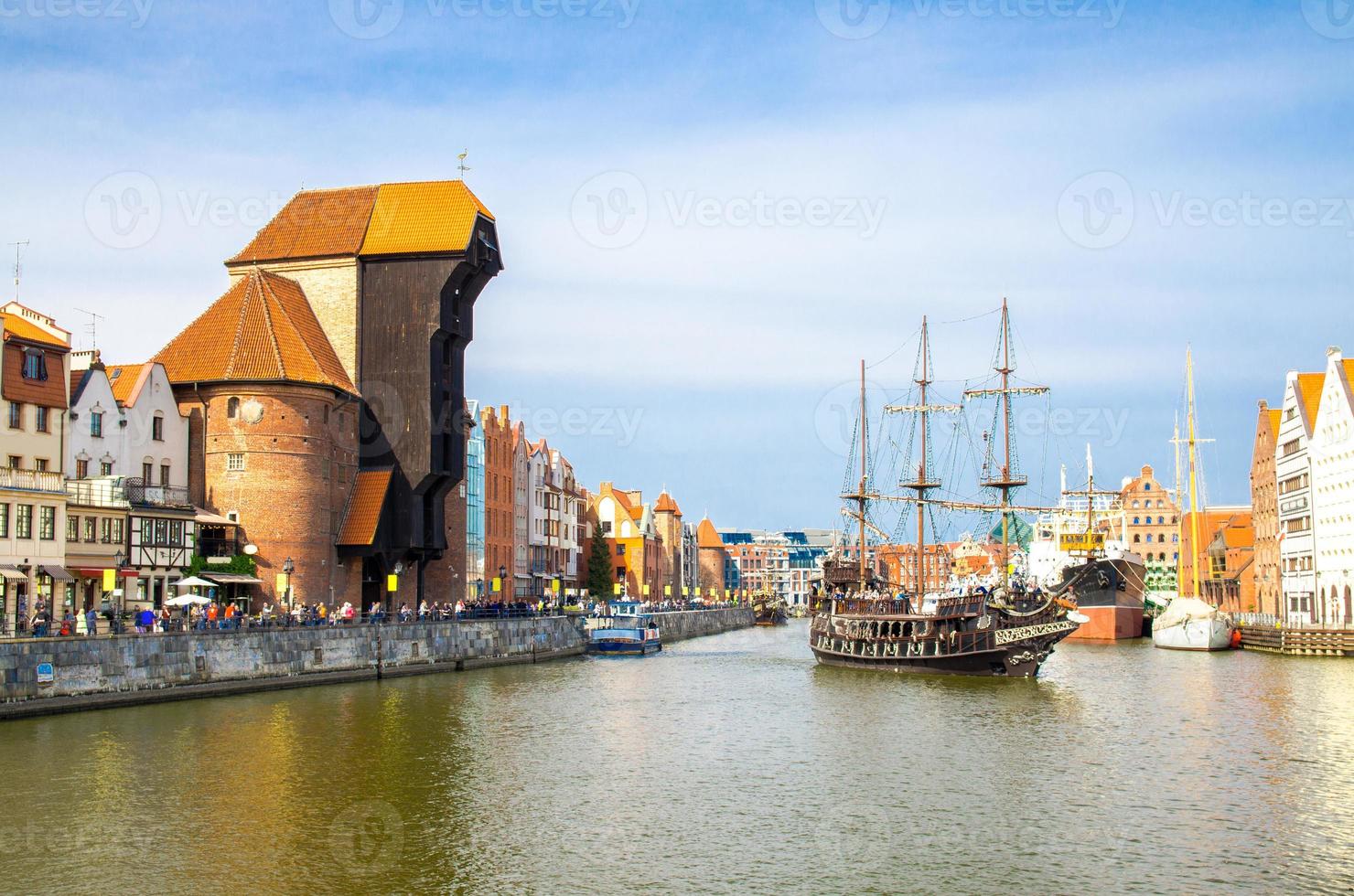 Zuraw Crane and colorful buildings on Motlawa river, Gdansk, Poland photo