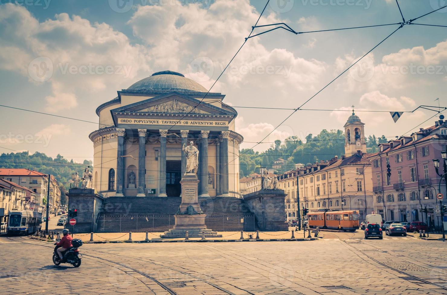 Bike and trams ride on square piazza in front of Catholic Parish Church Chiesa Gran Madre Di Dio photo