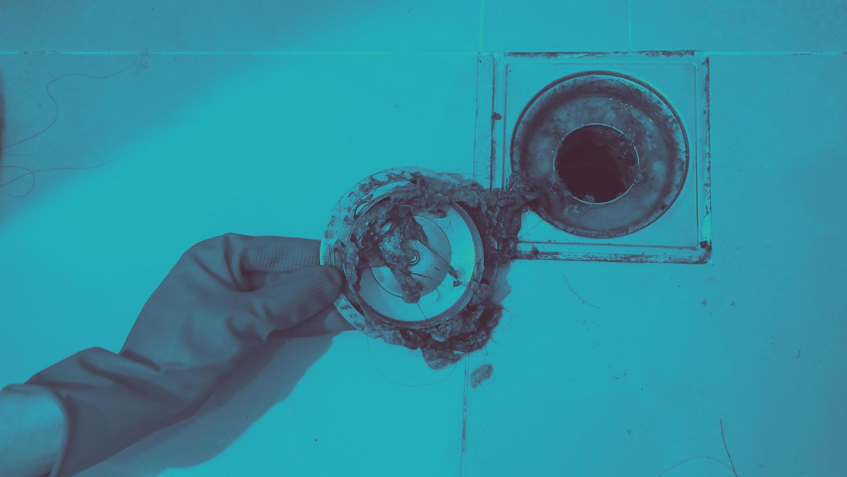 Drain cleaning. Clogged and dirty sewer pipes floor drain. photo