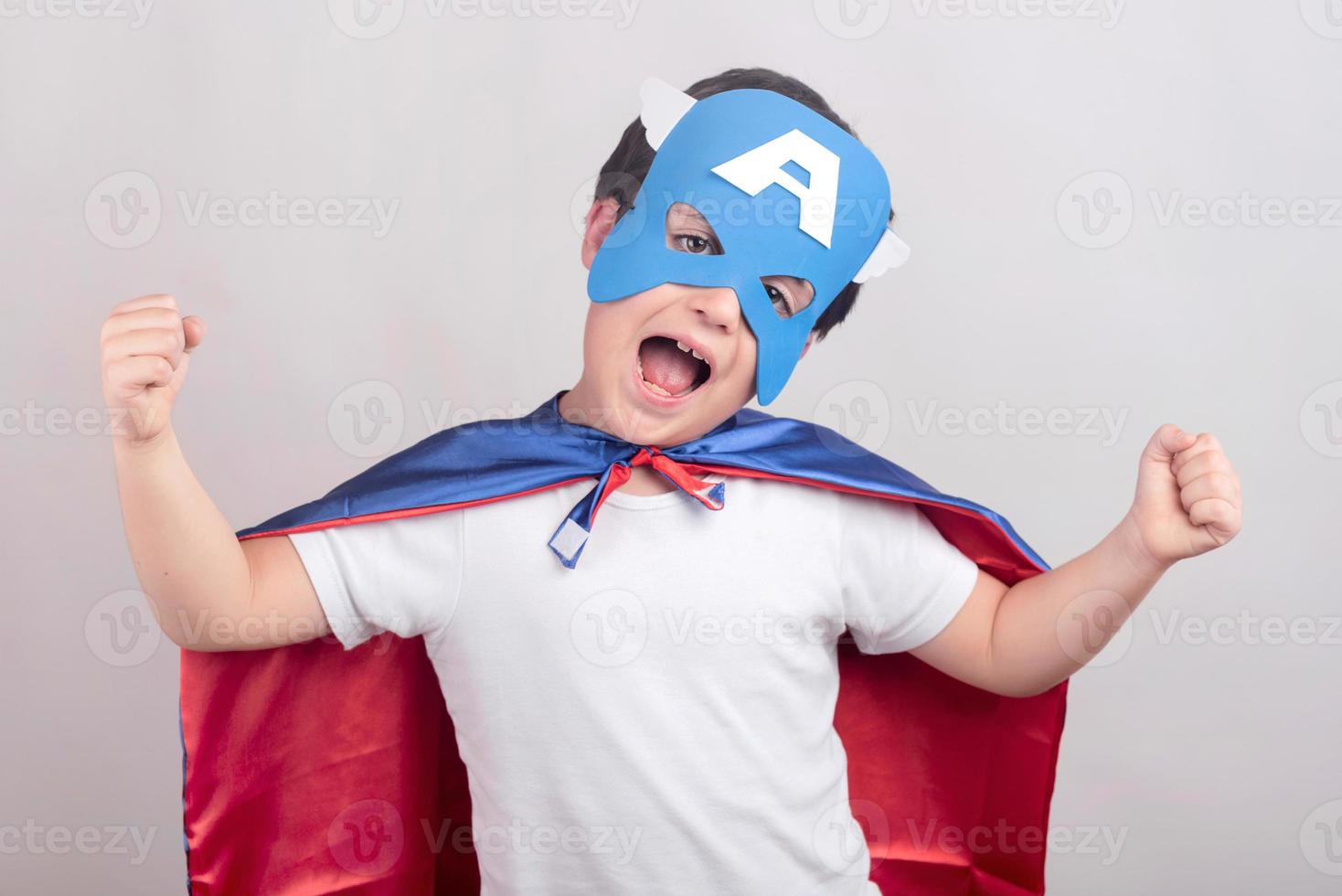 funny child dressed as superhero photo