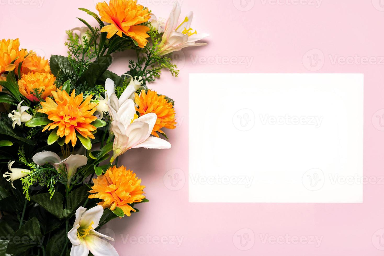 Happy Mother's Day.Bouquet of yellow flowers and white paper with copy space background photo