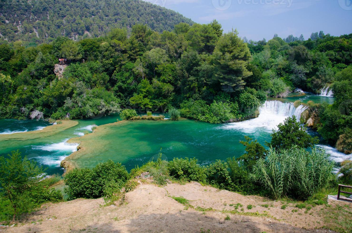 Waterfalls among green plants in Krka National Park, Dalmatia, Croatia photo