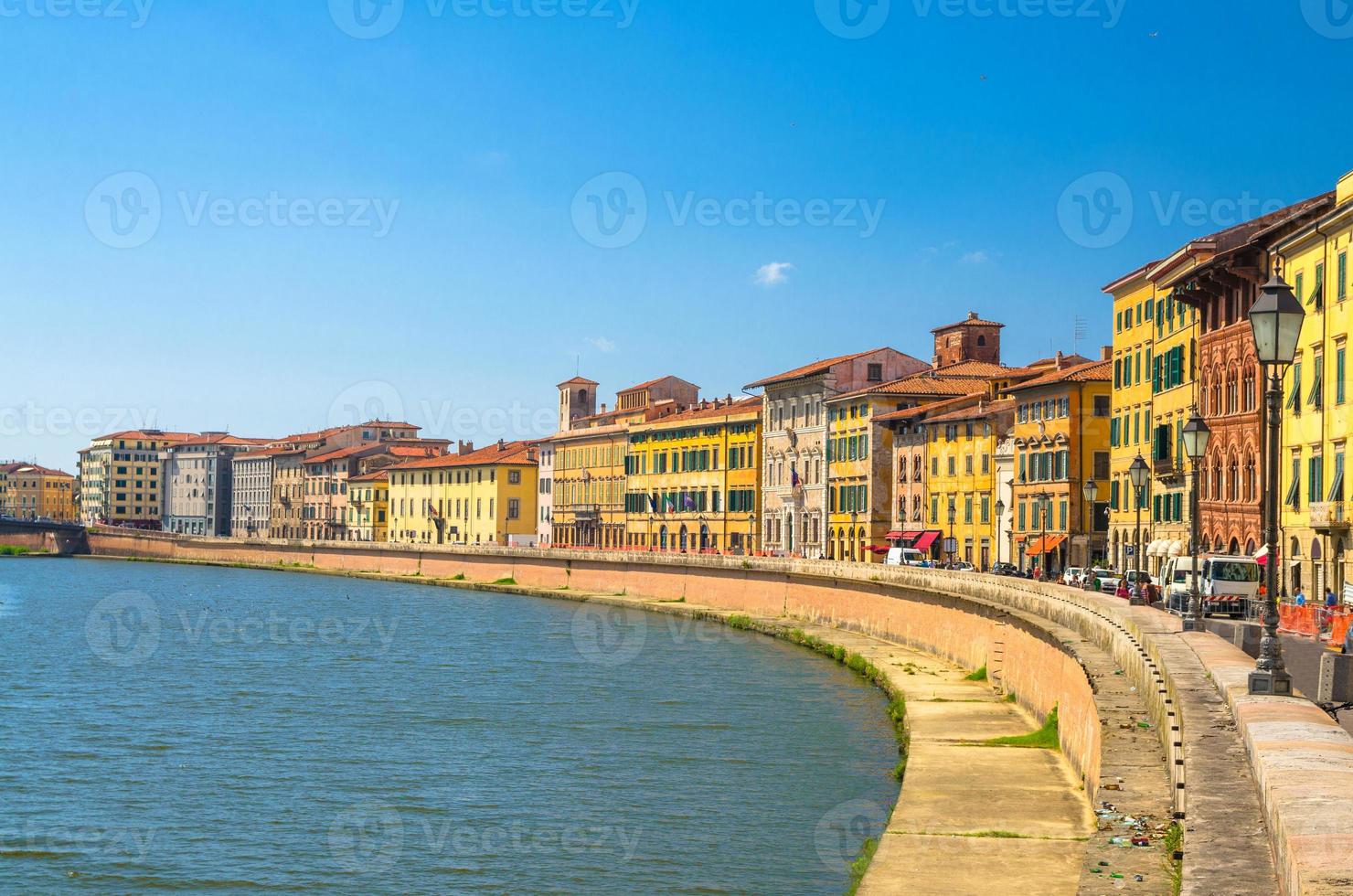 Row of old colorful buildings houses on embankment promenade of Arno river photo