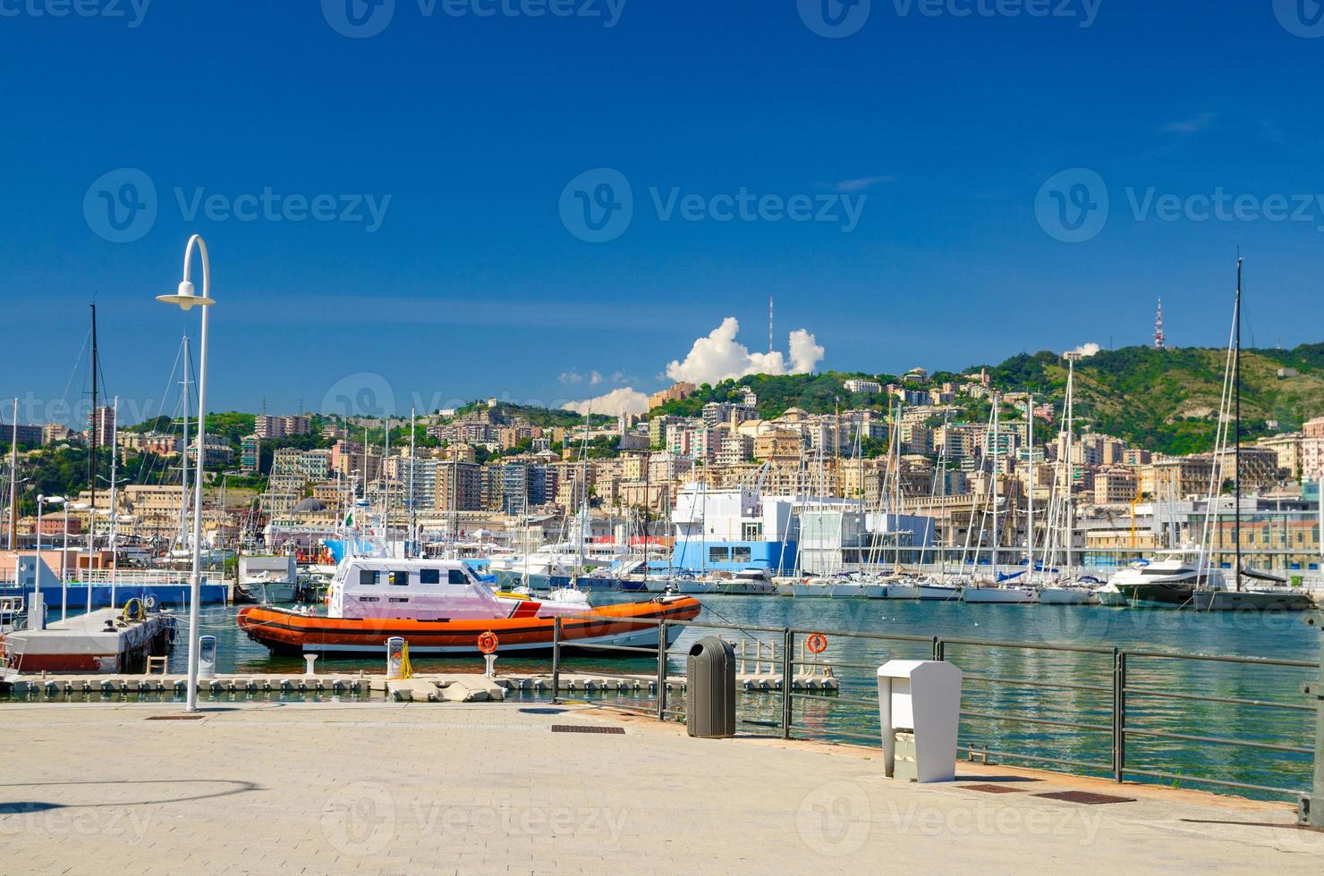 Port Porto Antico harbor with luxury white yachts in historical centre of old european city Genoa photo