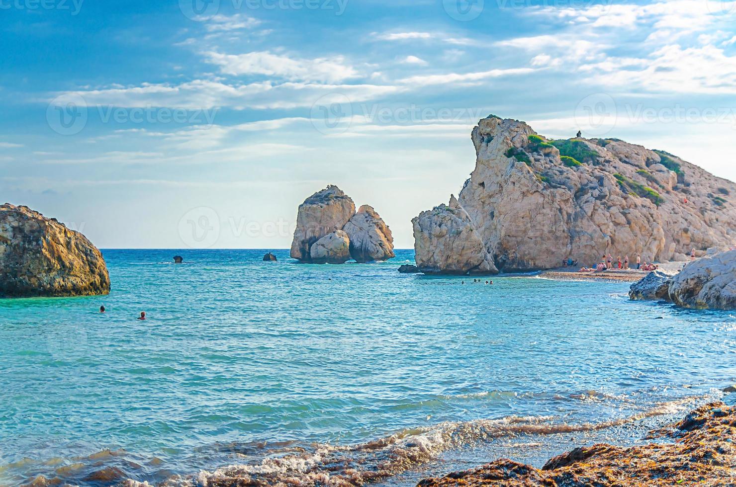 Aphrodite Beach with Stone Rocks in Aphrodite bay of Mediterranean sea water photo