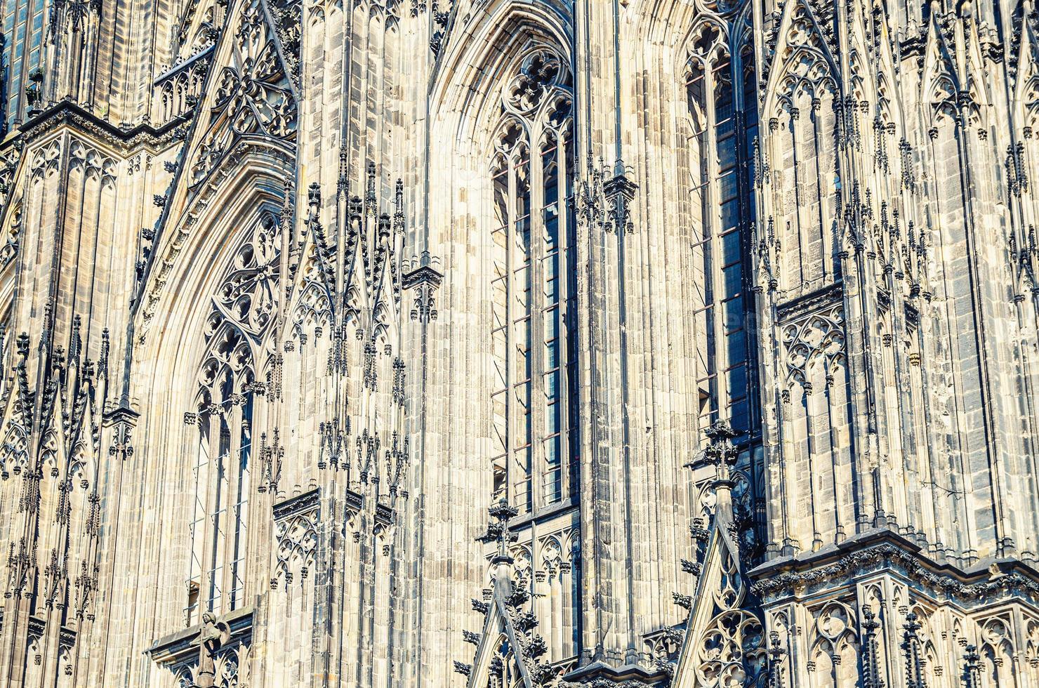 Close-up view of Cologne Cathedral Catholic Church gothic style building wall facade photo